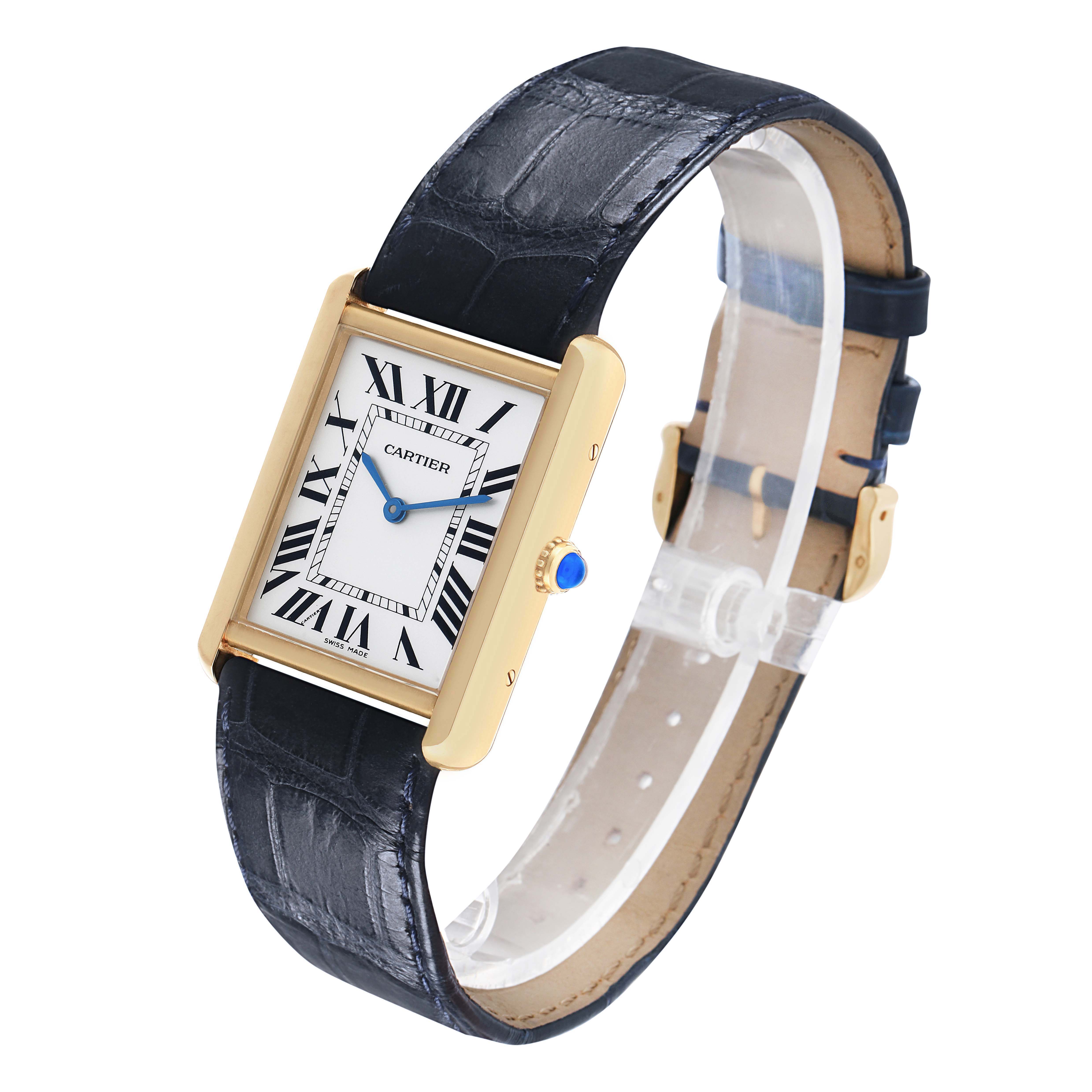 The Cartier Tank Solo W1018855 Men's Yellow Gold Silver Dial watch is shown at an angled side view, highlighting its rectangular face and leather strap.