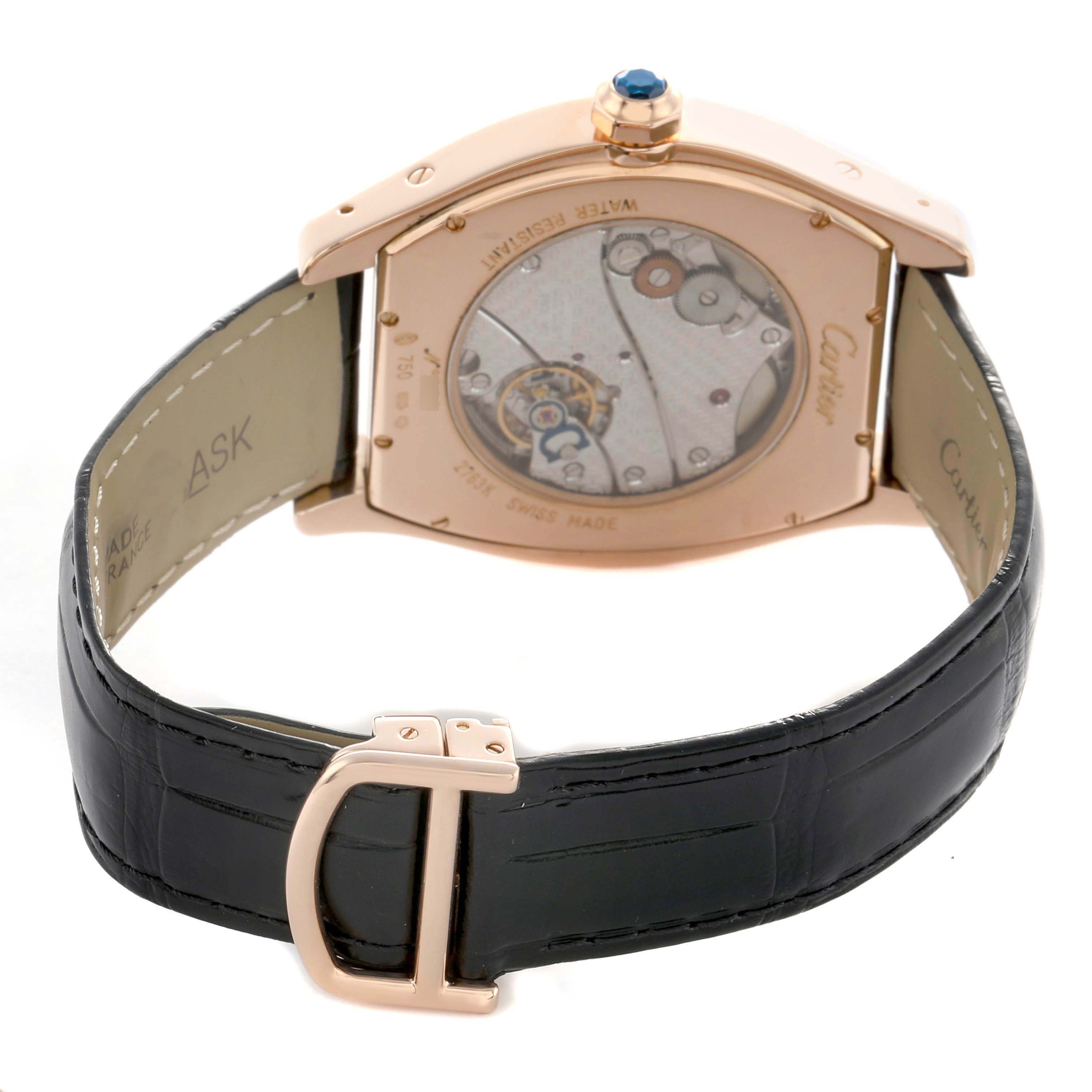 The image shows the back of a Cartier Tortue W1546051 Men's Rose Gold Silver Dial watch, highlighting the movement and leather strap with a buckle.