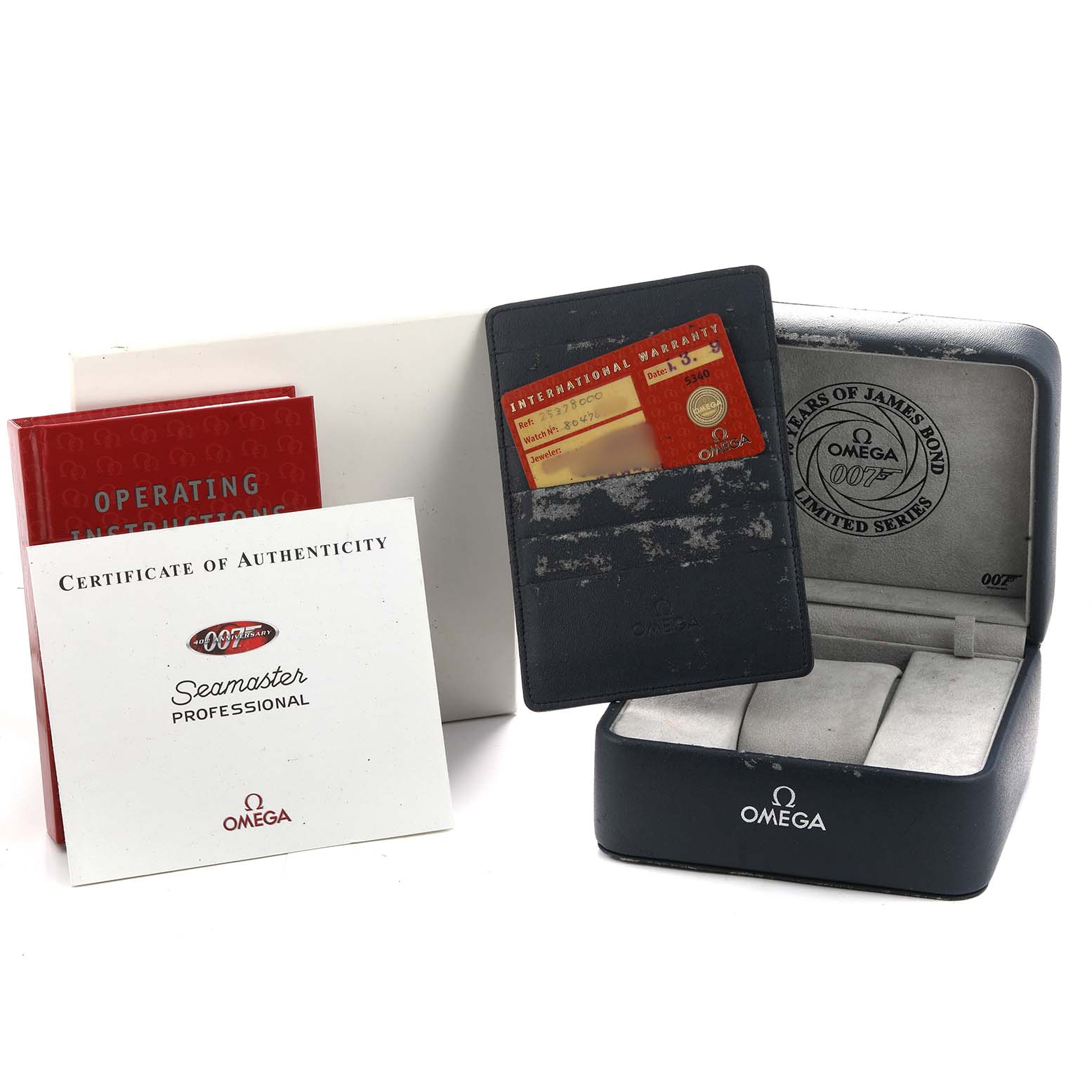 The image shows Omega Seamaster 2537.80.00 Men's Stainless Steel Blue Dial accessories: a watch box, warranty card, operating instructions, and certificate of authenticity.