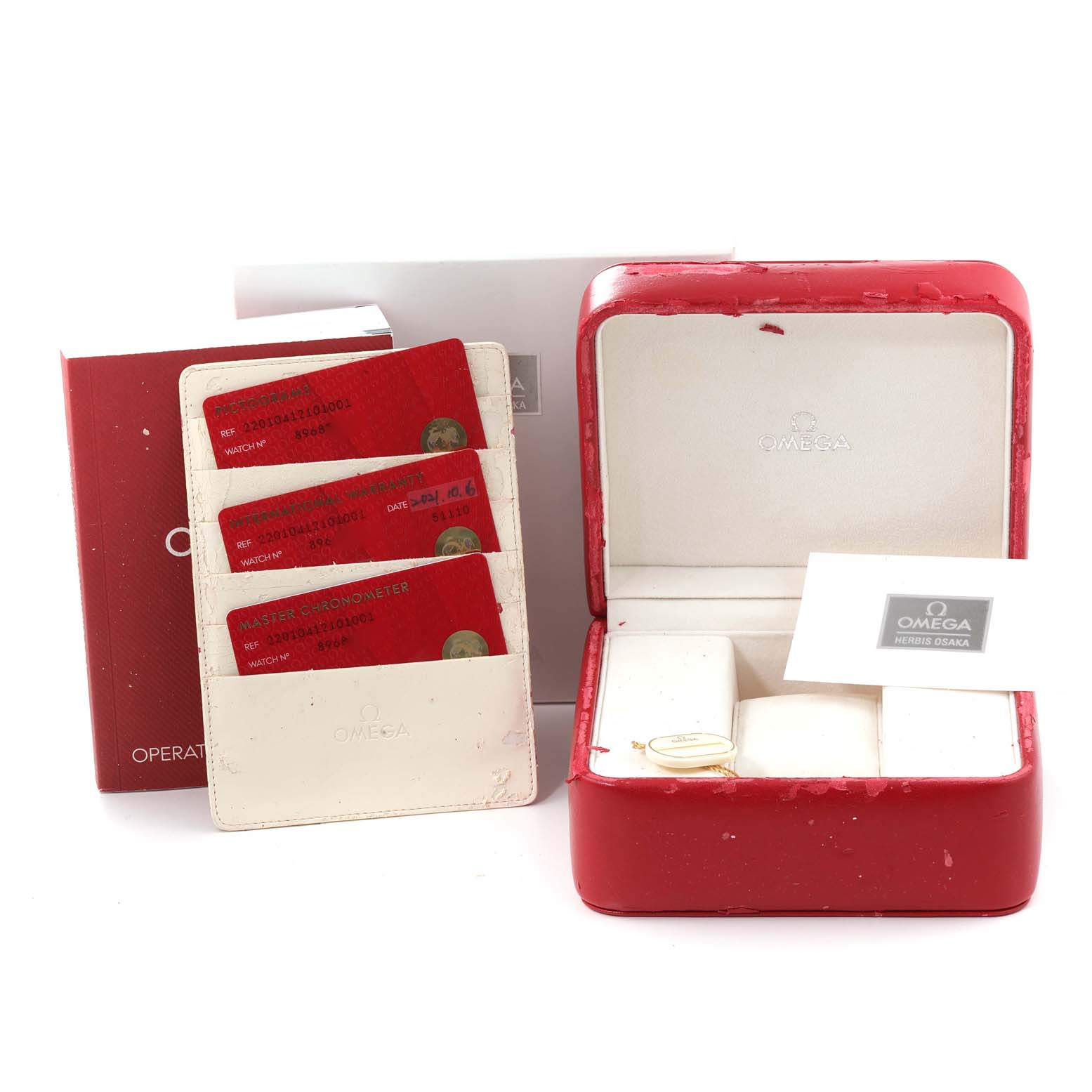 The image shows an Omega Aqua Terra 220.10.41.21.01.001 Men's Stainless Steel Black Dial 220.10.41.21.01.001 Men's Stainless Steel Black Dial watch packaging, including a red box, warranty cards, and a manual.