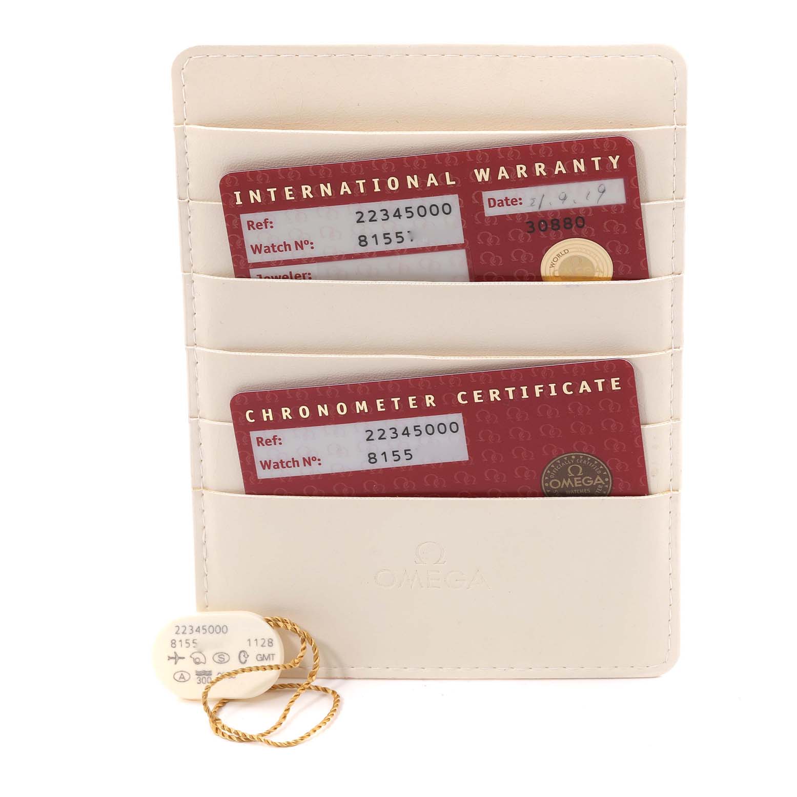 The image shows the warranty cards and a tag for the Omega Seamaster 2234.50.00 Men
s Stainless Steel Black Dial 2234.50.00 Men
s Stainless Steel Black Dial model in a leather card holder.