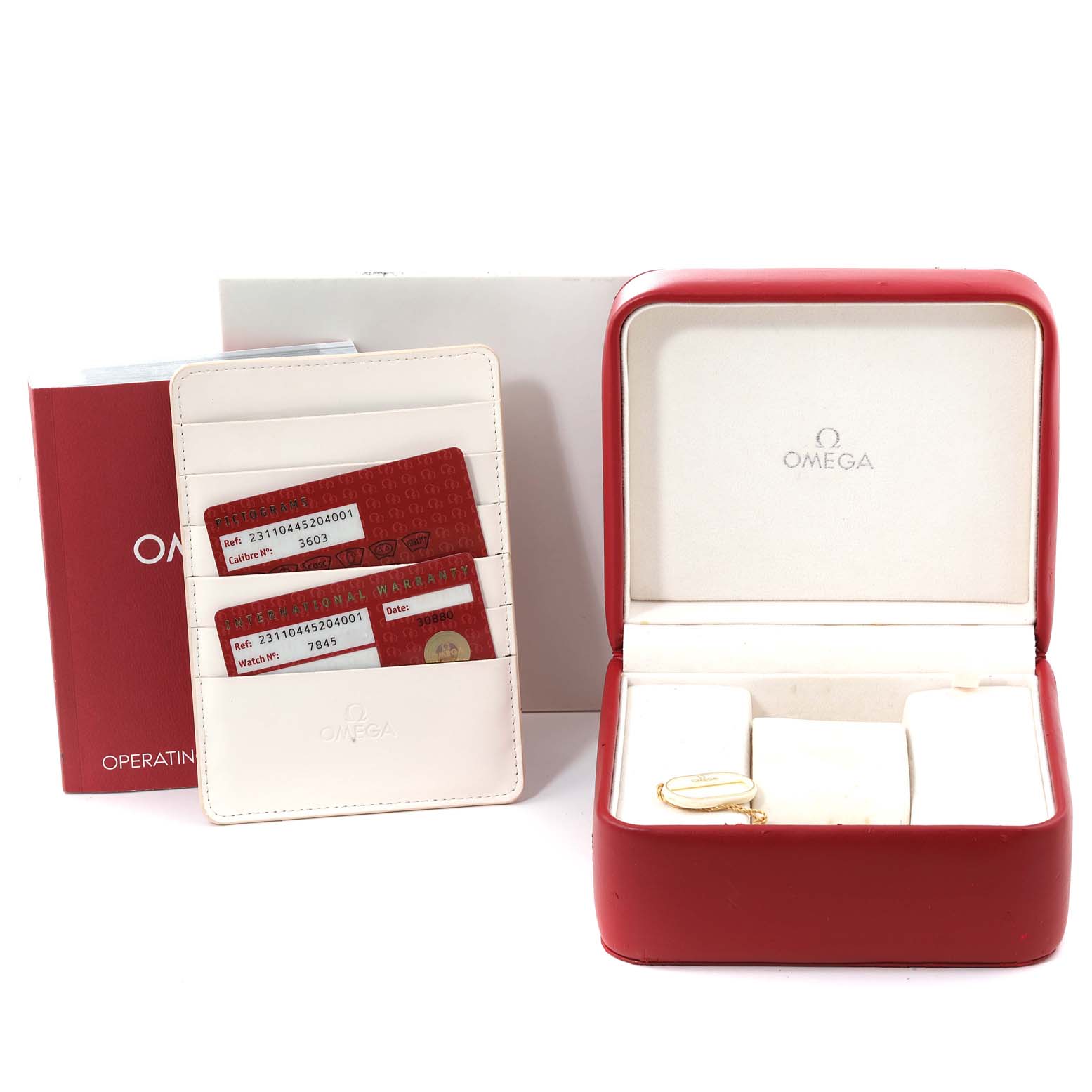 The image shows the open box, warranty cards, and an operating manual for the Omega Seamaster 231.10.44.52.04.001 Men
s Stainless Steel White Dial 231.10.44.52.04.001 Men
s Stainless Steel White Dial watch.