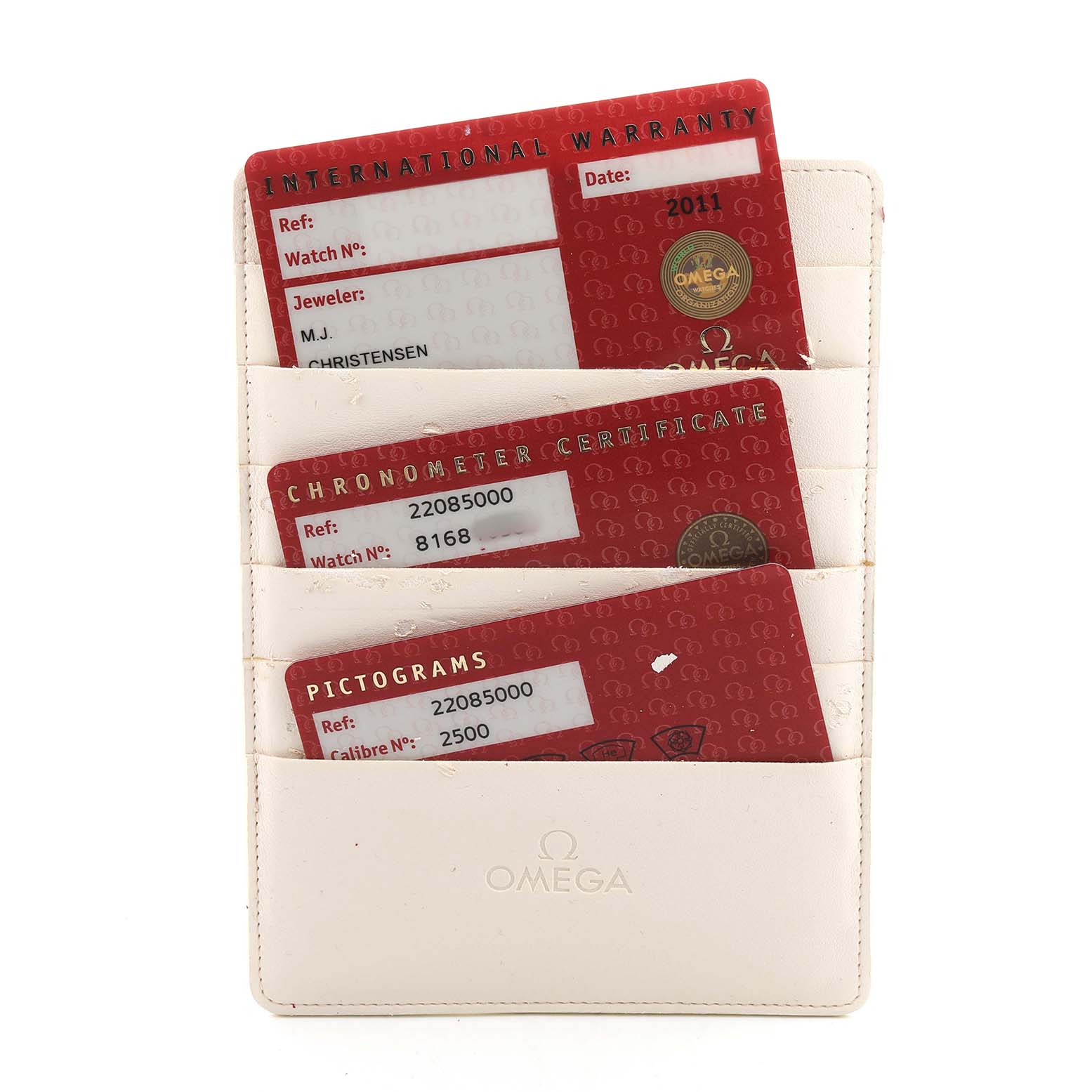 The image shows warranty cards and certificates for the Omega Planet Ocean 2208.50.00 Men's Stainless Steel Black Dial model in a white cardholder.