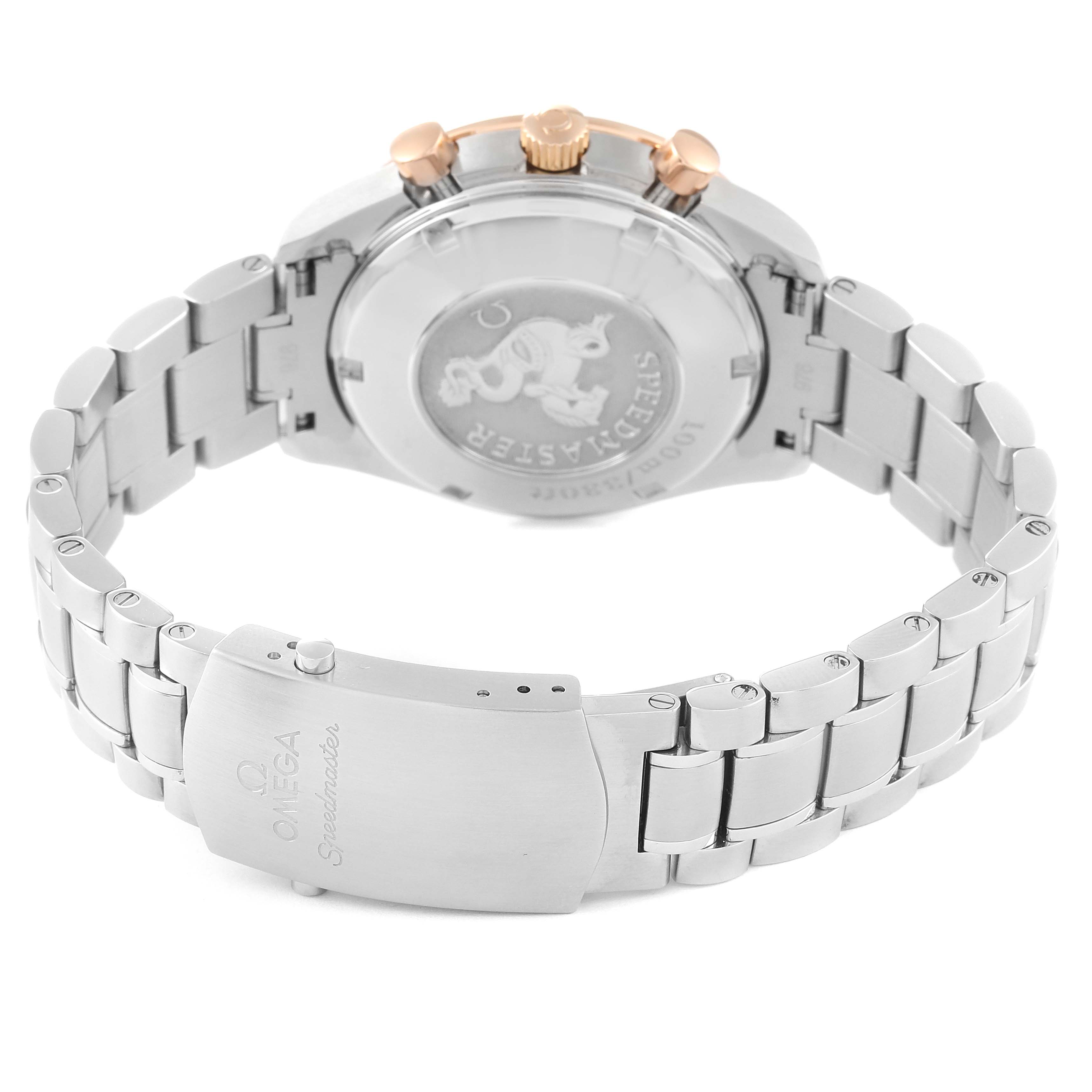 The image shows the back view of the Omega Speedmaster 323.21.40.40.01.001 Men's Steel and Gold (two tone) Black Dial 323.21.40.40.01.001 Men's Steel and Gold (two tone) Black Dial watch, highlighting its clasp and engraved case back.