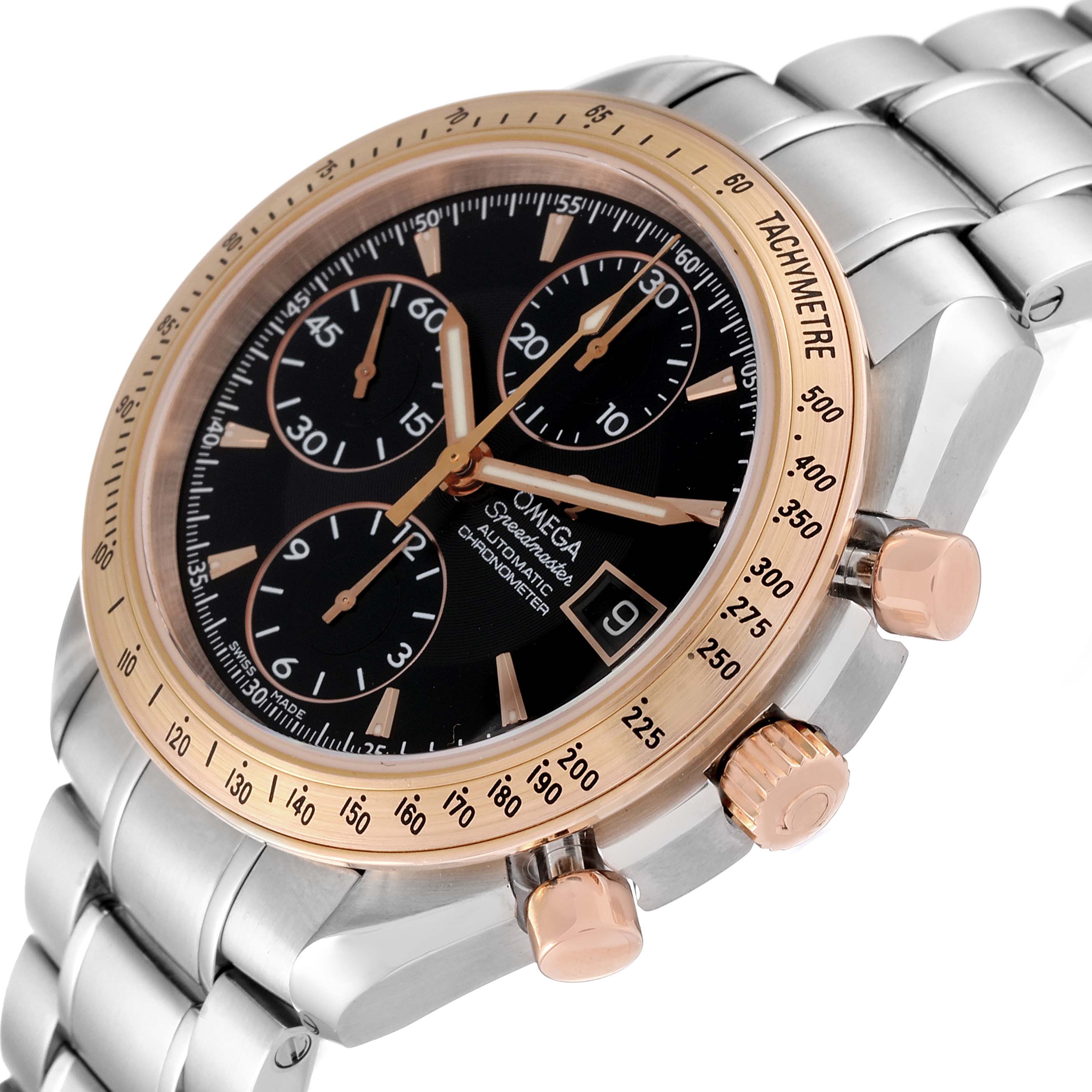 The image shows an angled view of the Omega Speedmaster 323.21.40.40.01.001 Men's Steel and Gold (two tone) Black Dial 323.21.40.40.01.001 Men's Steel and Gold (two tone) Black Dial watch, highlighting the face, bezel, crown, and chronograph pushers.