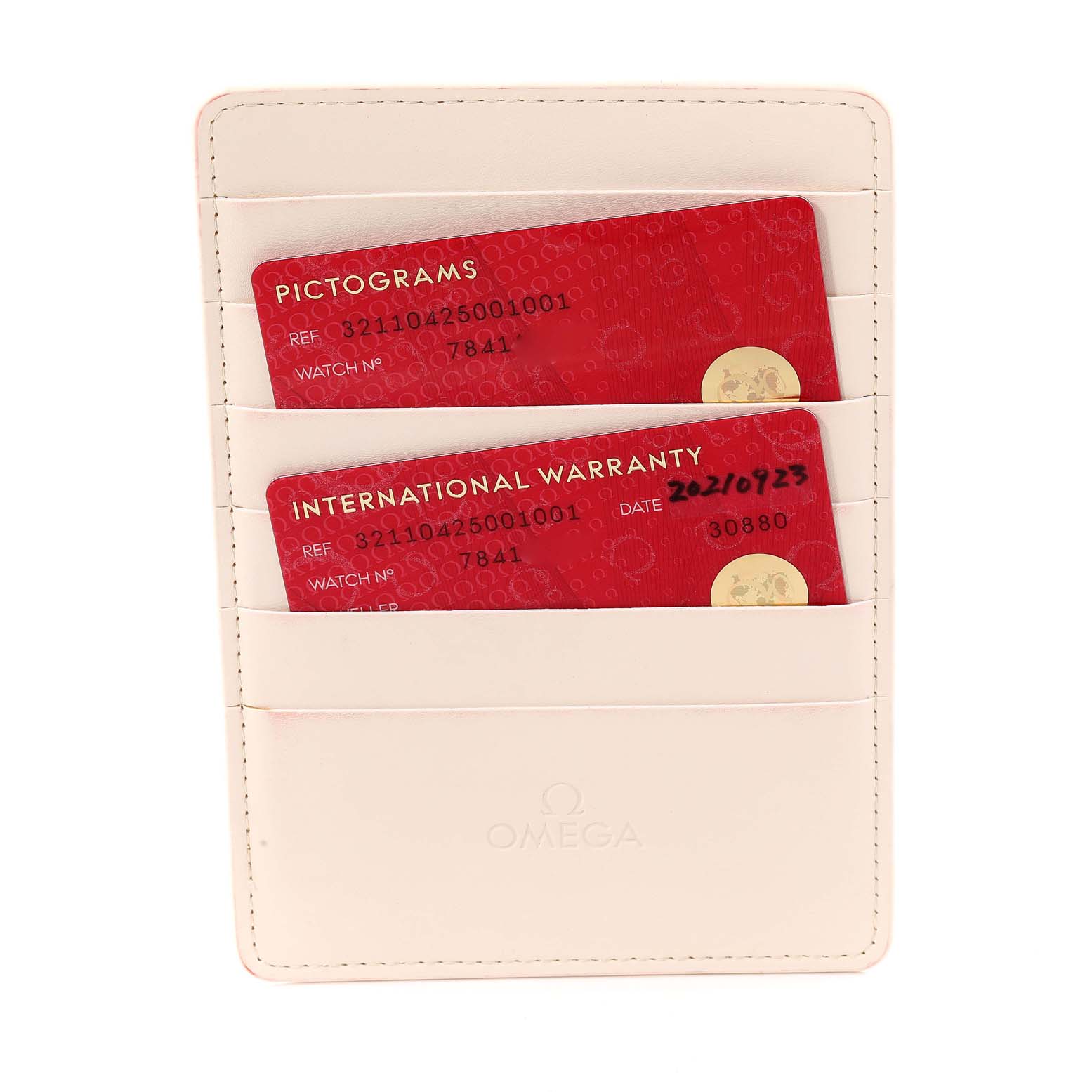 The image shows an Omega Speedmaster 321.10.42.50.01.001 Men
s Stainless Steel Black Dial 321.10.42.50.01.001 Men
s Stainless Steel Black Dial model
s warranty and pictogram cards in a branded case.