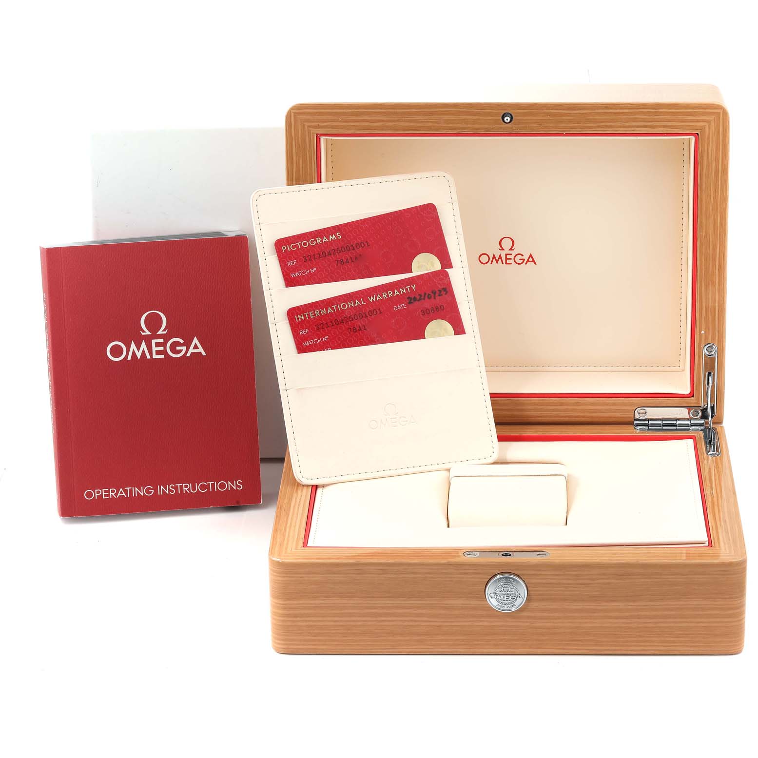 The image shows the Omega Speedmaster 321.10.42.50.01.001 Men
s Stainless Steel Black Dial 321.10.42.50.01.001 Men
s Stainless Steel Black Dial watch
s wooden box, operating instructions, and warranty cards.