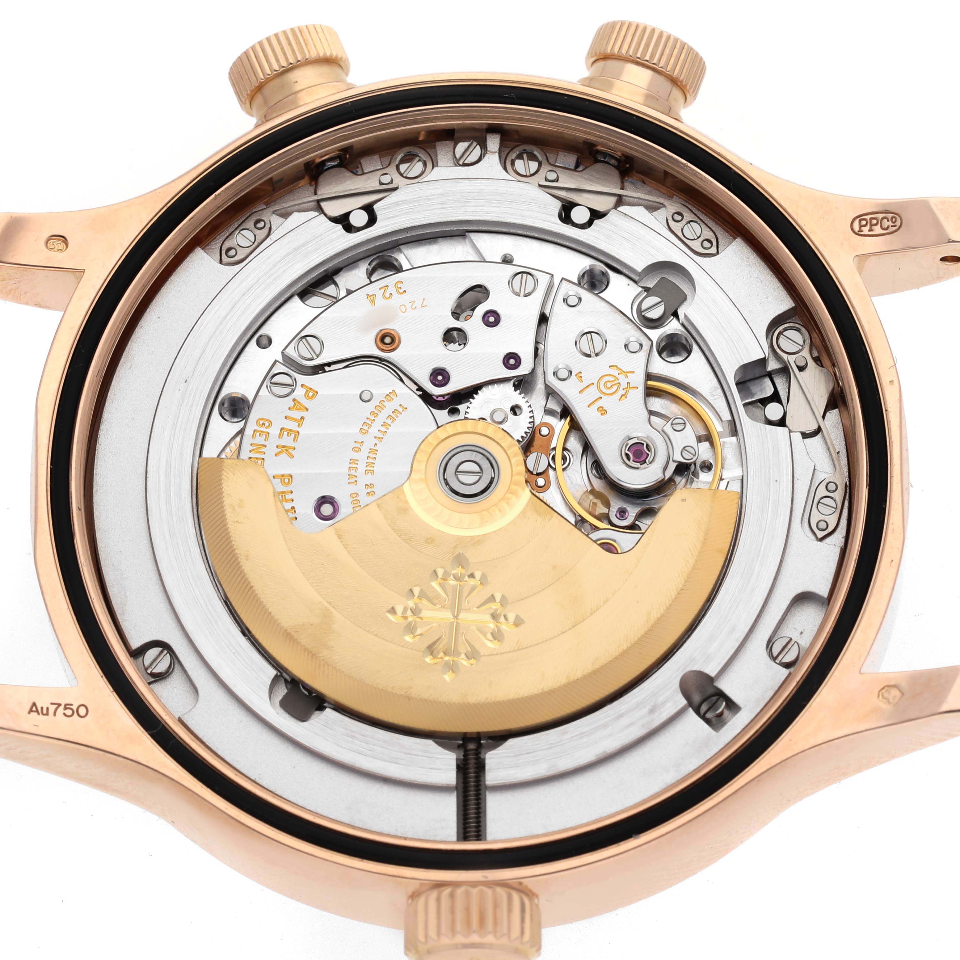 The image shows the back view of a Patek Philippe Calatrava 5524R-001 Men's Rose Gold Brown Dial, revealing the internal mechanical movement.