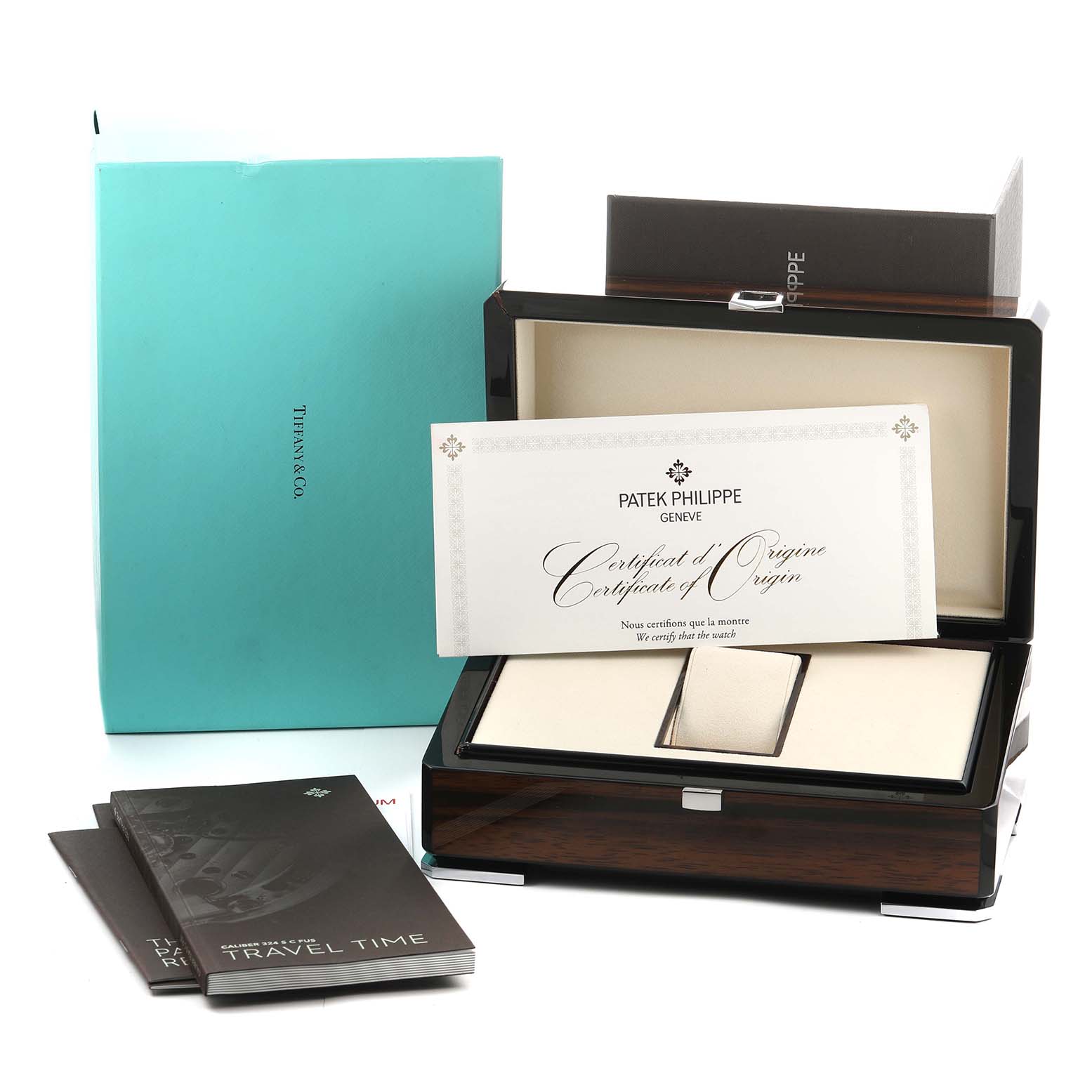 The image shows a Patek Philippe Calatrava 5524R-001 Men's Rose Gold Brown Dial watch box with certificates, booklets, and packaging viewed from the front angle.