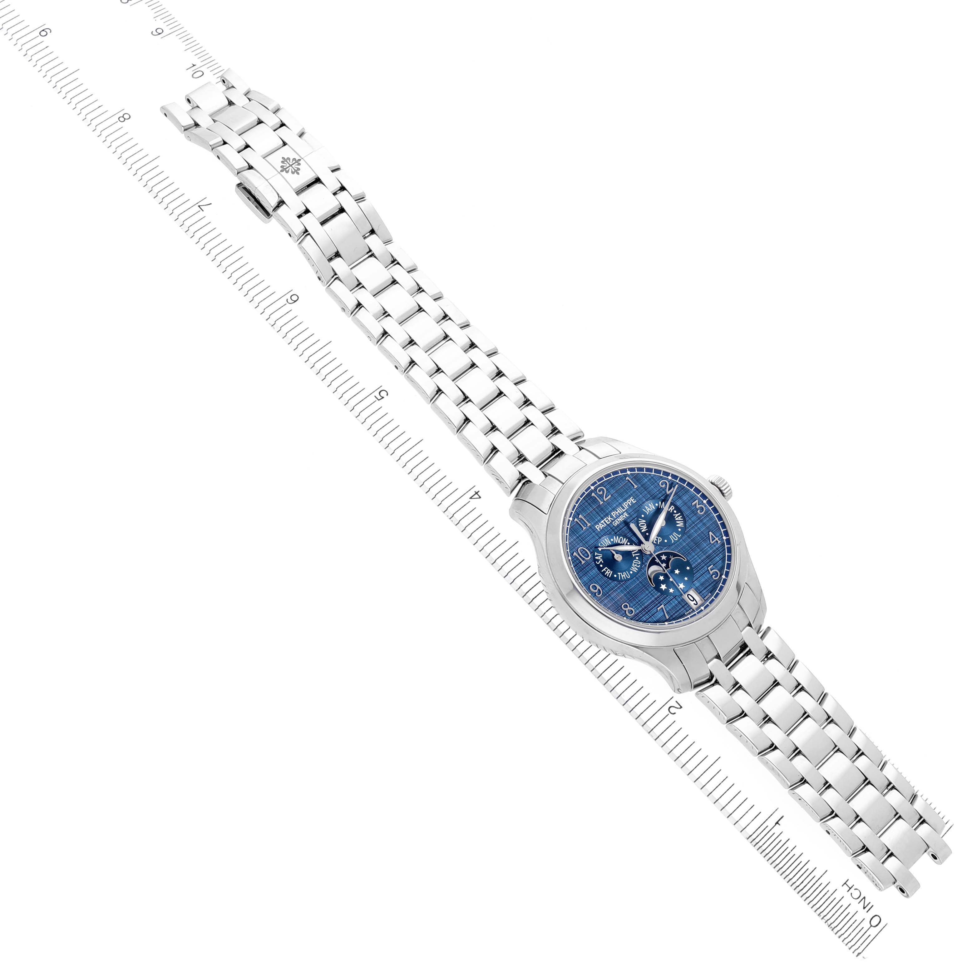 The Patek Philippe Complications 4947/1A-001 Men's Stainless Steel Blue Dial 4947/1A-001 Men's Stainless Steel Blue Dial watch is shown diagonally, displaying the face, bracelet, and clasp.