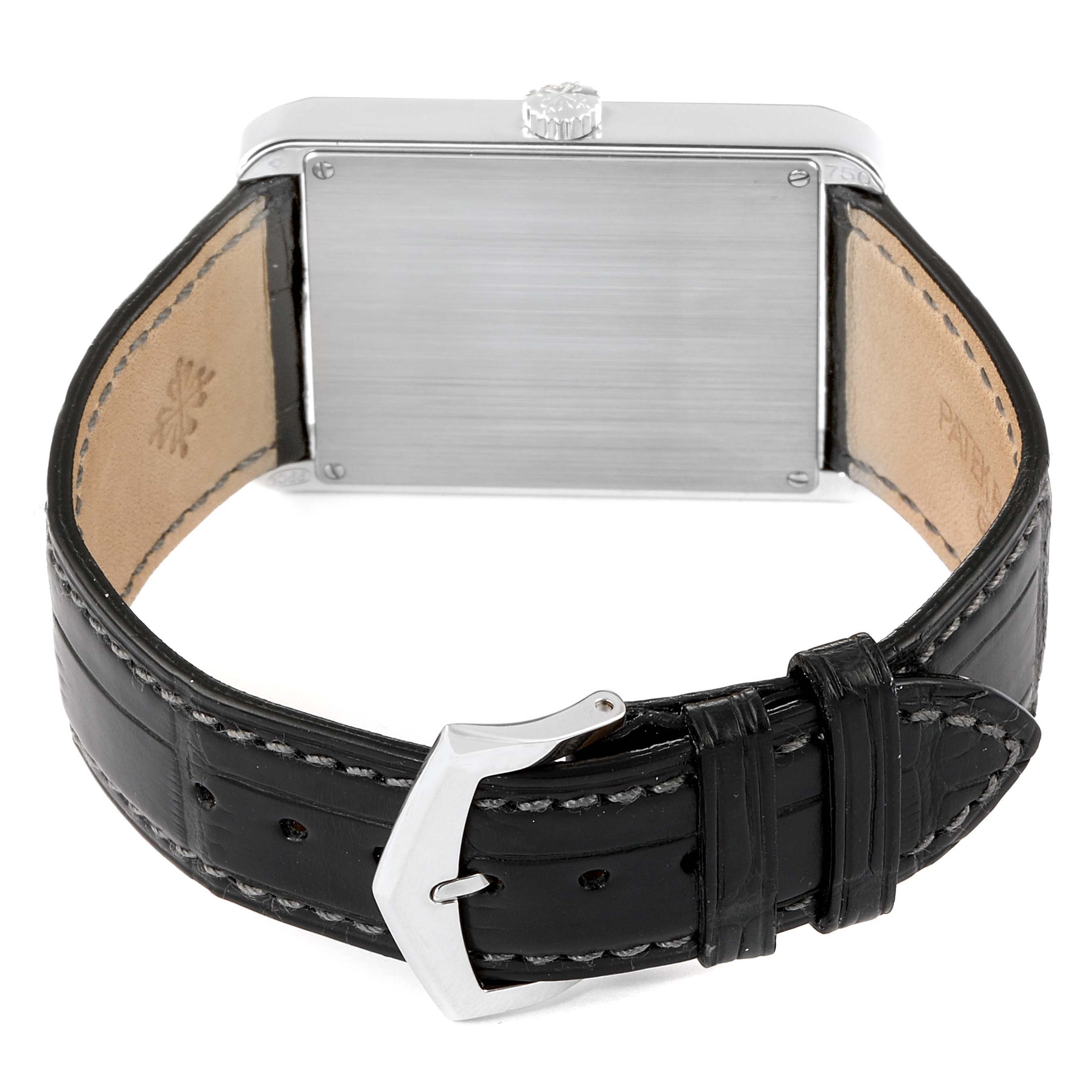 The image shows the back view of the Patek Philippe Gondolo 5109 Men's White Gold Silver Dial 5109 Men's White Gold Silver Dial watch, including its case, crown, black leather band, and buckle.