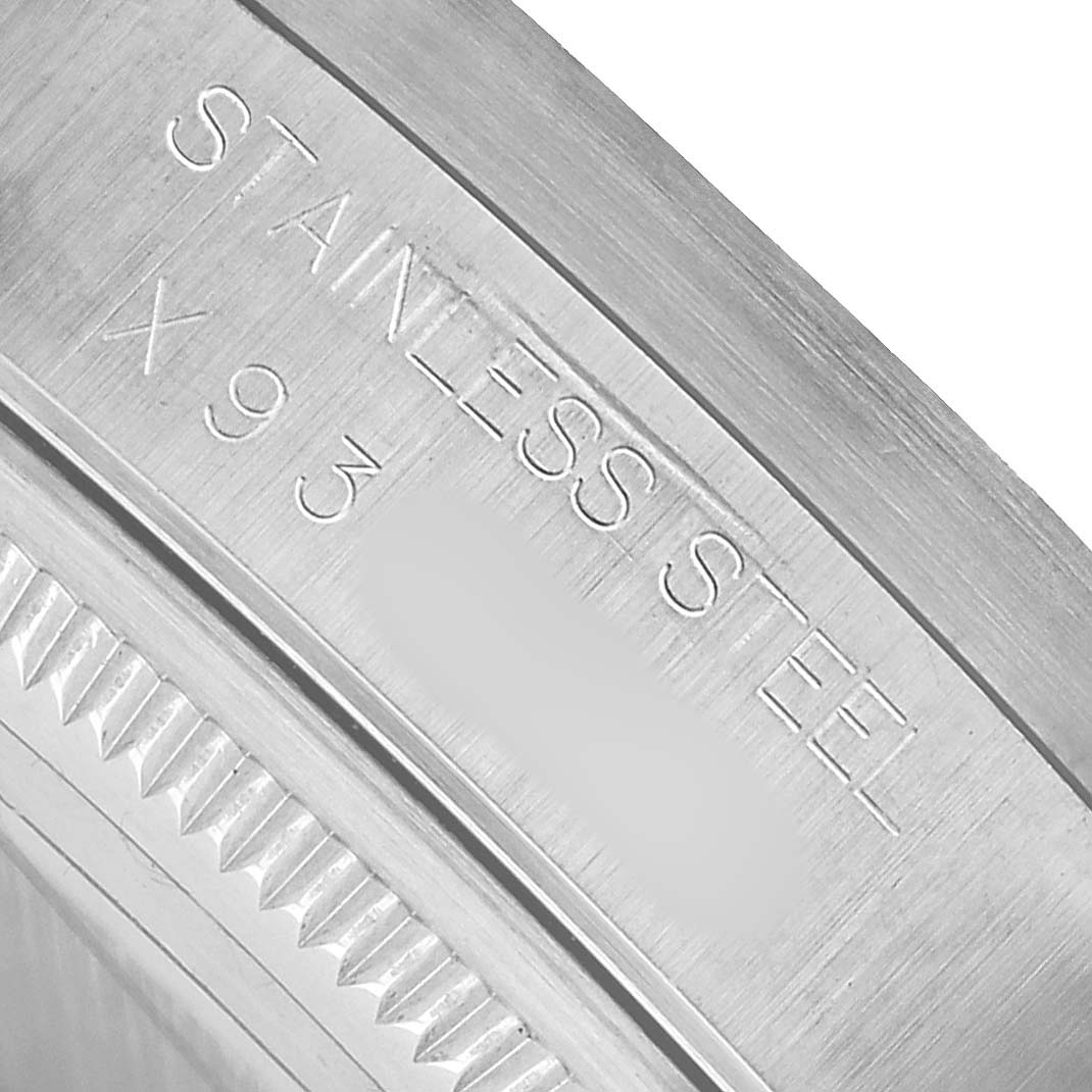 The image shows a close-up of the stainless steel bezel and inner edge of the Rolex Air-King 14010 Men's Stainless Steel Black Dial watch.