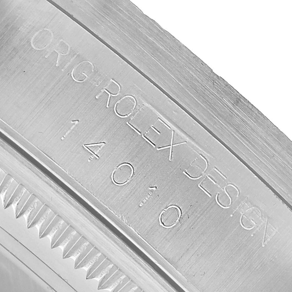 The image shows an engraved side view of the bezel and case with "Orig Rolex Design" on the Rolex Air-King 14010 Men's Stainless Steel Black Dial watch.