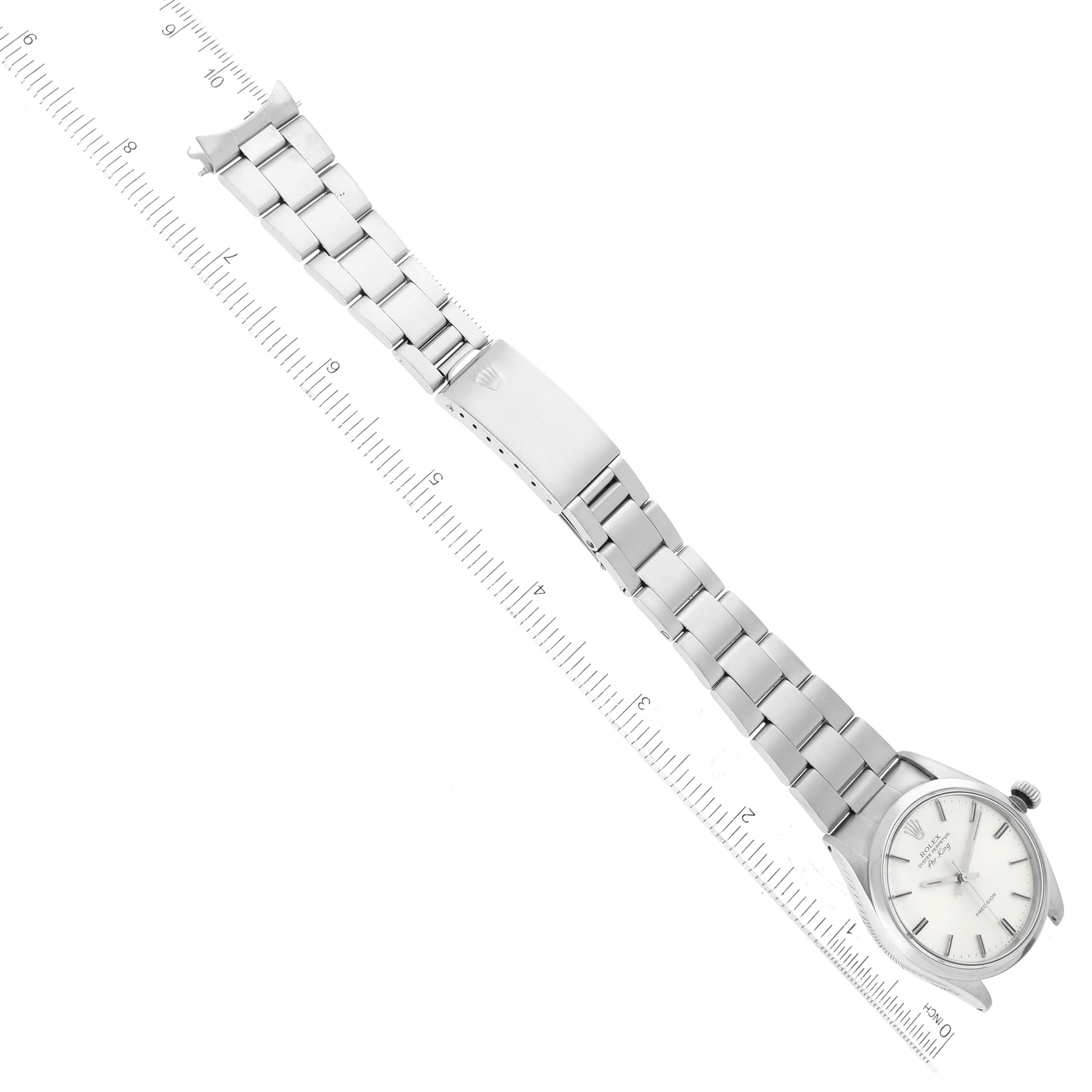 The image shows a full view of the Rolex Vintage Collection 5500 Men's Stainless Steel Silver Dial 5500 Men's Stainless Steel Silver Dial watch, with the watch face, bezel, and entire bracelet displayed alongside a ruler.