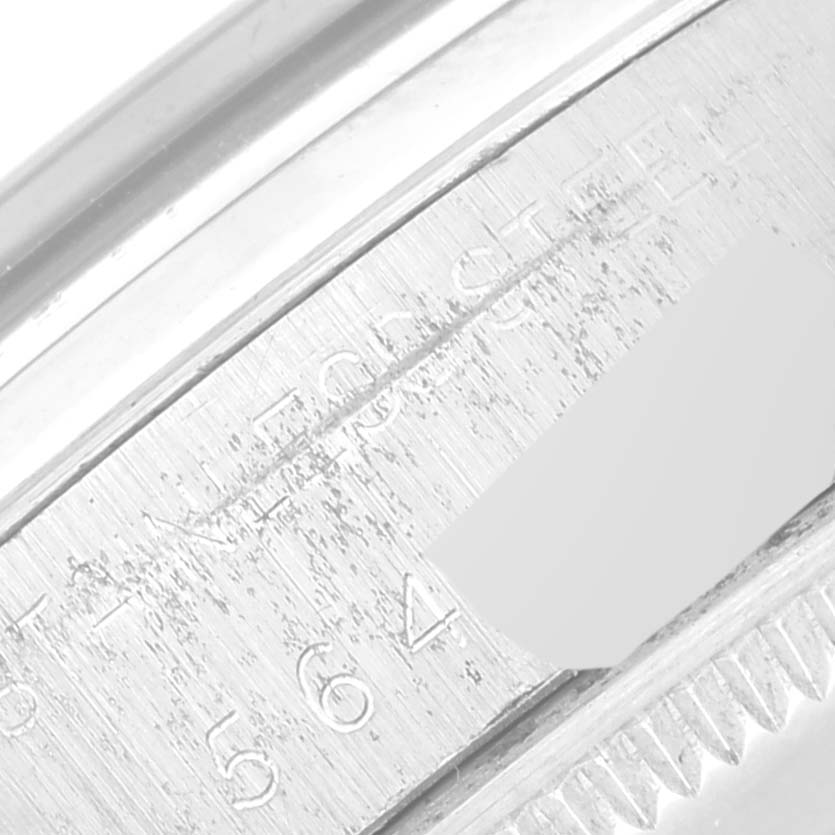 This image shows a close-up of the inner bezel and part of the case of the Rolex Vintage Collection 5500 Men's Stainless Steel Silver Dial 5500 Men's Stainless Steel Silver Dial watch, featuring engraved details.
