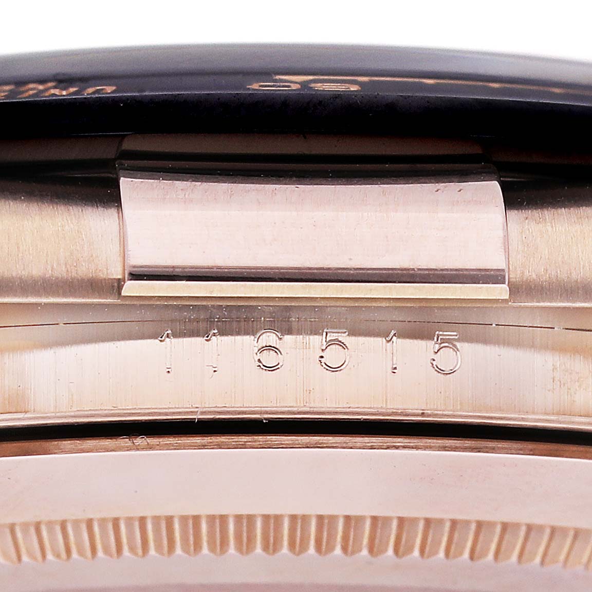 The image shows the side and serial number of a Rolex Daytona 116515LN Men's Rose Gold Champagne Dial 116515LN Men's Rose Gold Champagne Dial watch.