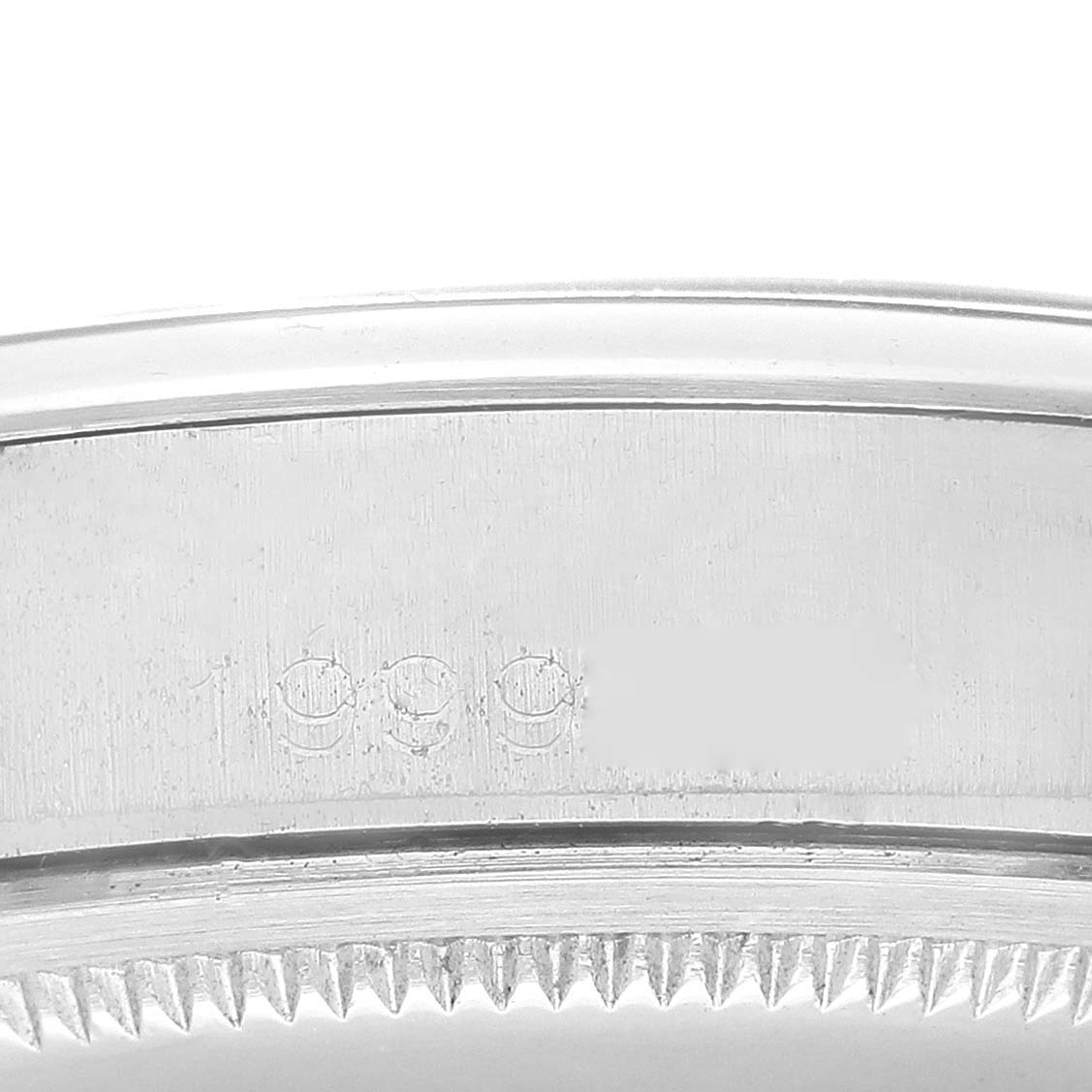 This image shows a close-up of the side engraving on the case back of a Rolex Vintage Collection 1500 Men's Stainless Steel Blue Dial 1500 Men's Stainless Steel Blue Dial model watch.