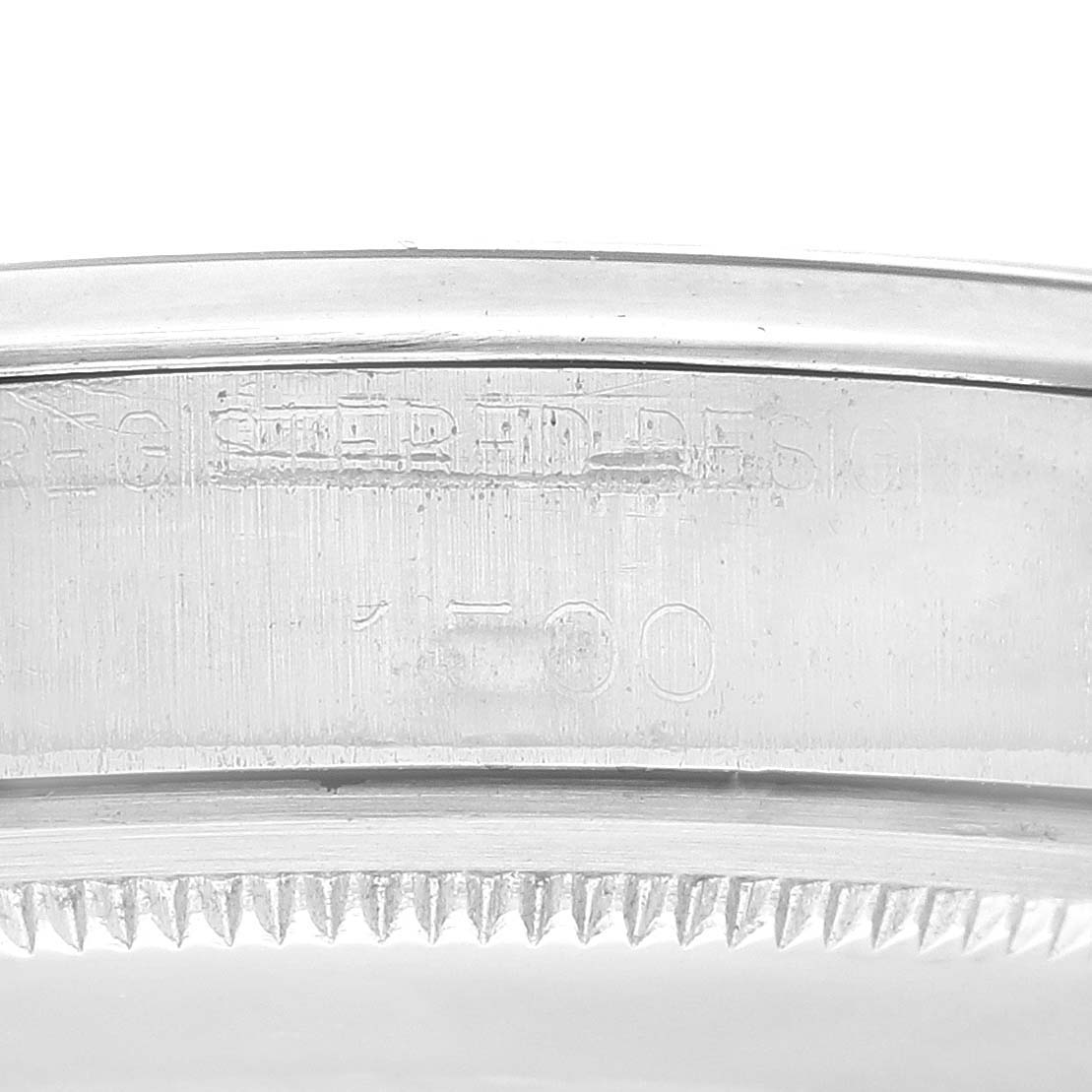 The image shows the side view of the casing with engravings on the bezel of a Rolex Vintage Collection 1500 Men's Stainless Steel Blue Dial 1500 Men's Stainless Steel Blue Dial model watch.