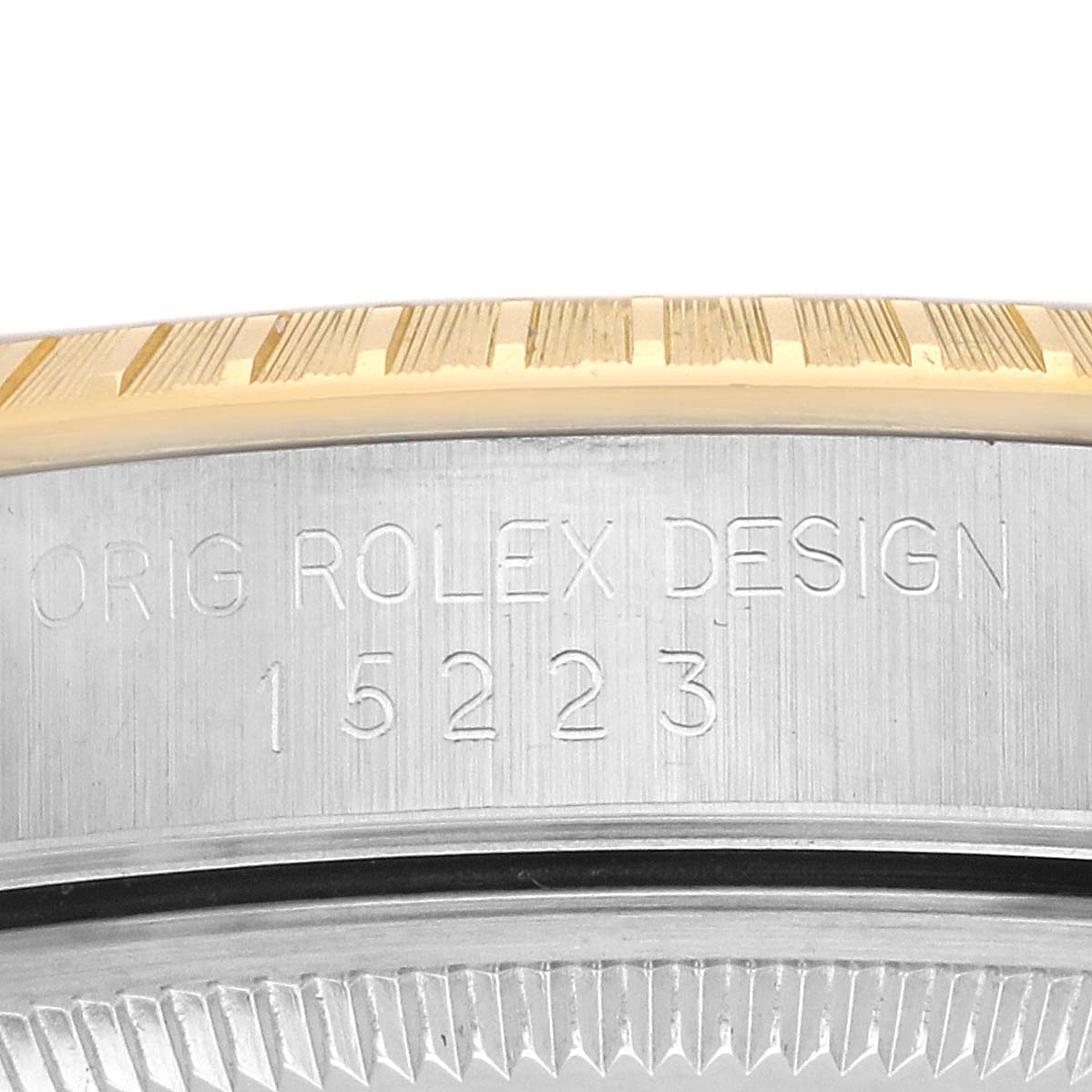 The image shows a side view of the Rolex Date 15223 Men's Steel and Gold (two tone) Champagne Dial model case, highlighting the model number and the fluted bezel.
