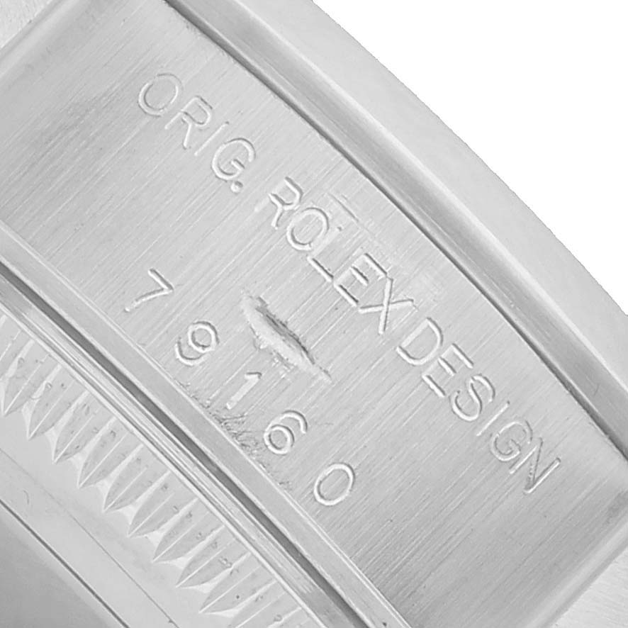 The image shows a close-up of the case with model number engraving on a Rolex Date 79160 Women's Stainless Steel White Dial watch.