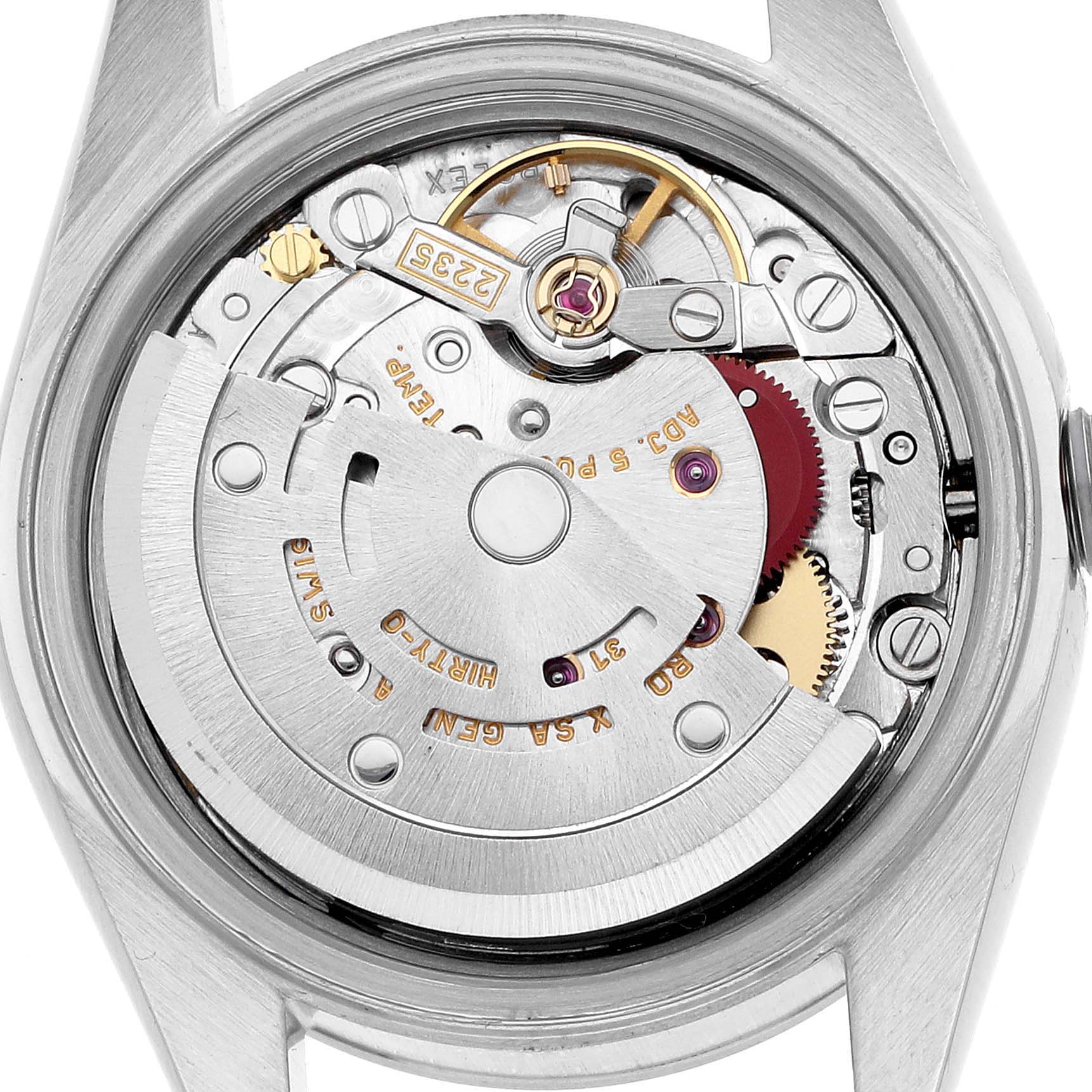 The image shows a close-up of the Rolex Date 79160 Women's Stainless Steel White Dial model's movement from the back, highlighting the intricate internal mechanism.