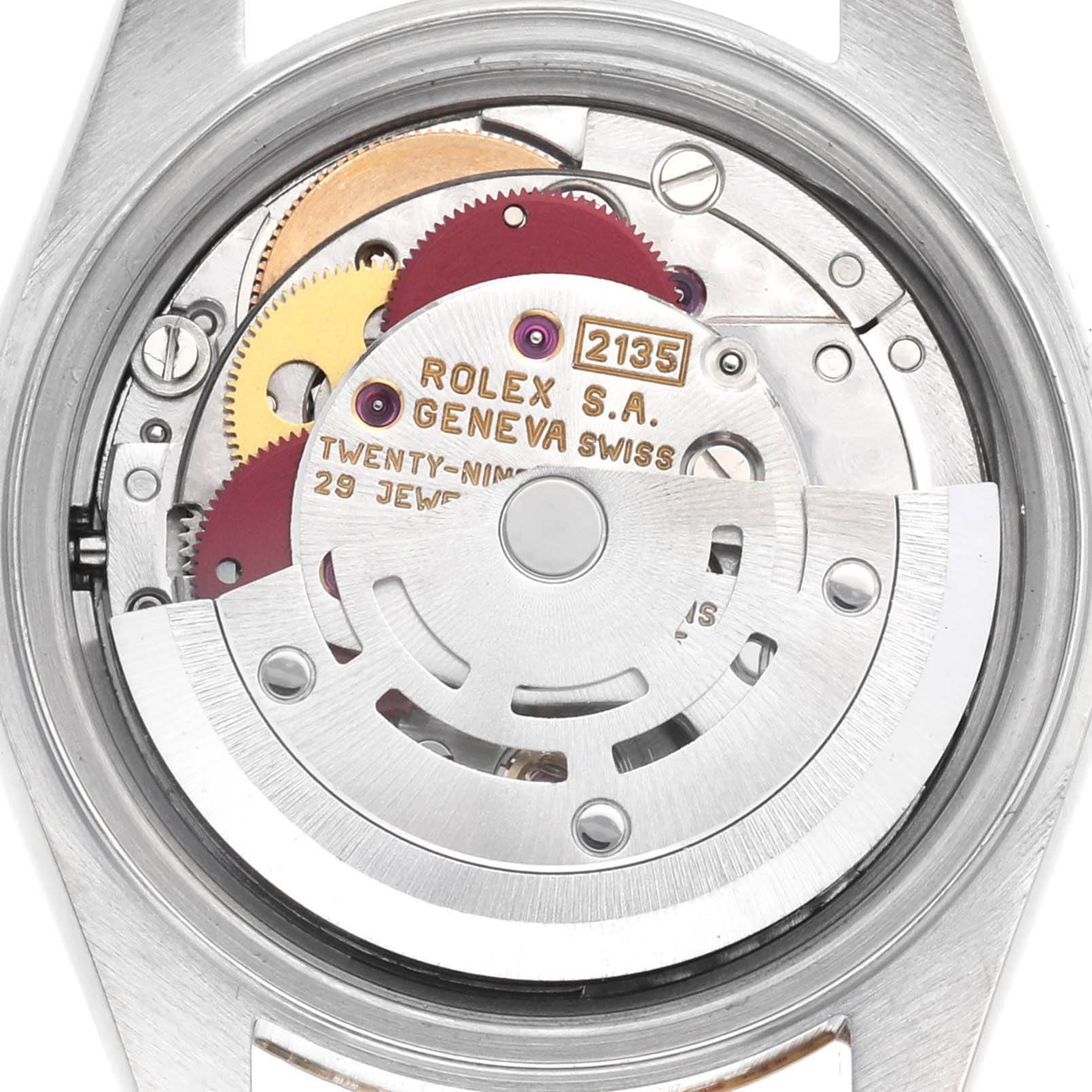 The image shows the movement of a Rolex Datejust 69173 Women's Steel and Gold (two tone) Champagne Dial, viewed from the back, highlighting gears and the rotor mechanism.