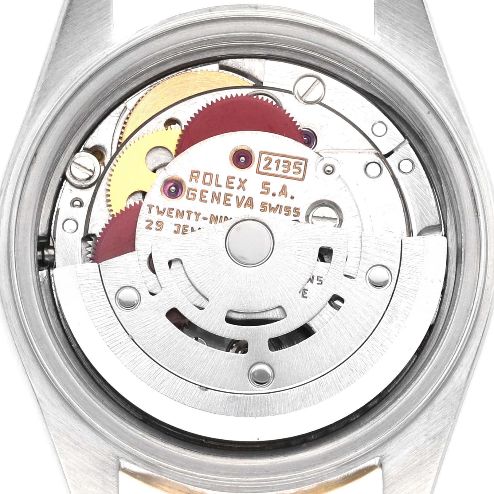 The image shows the inner mechanism of a Rolex Datejust 69173 Women's Steel and Gold (two tone) Champagne Dial watch from the back, highlighting gears and the rotor.