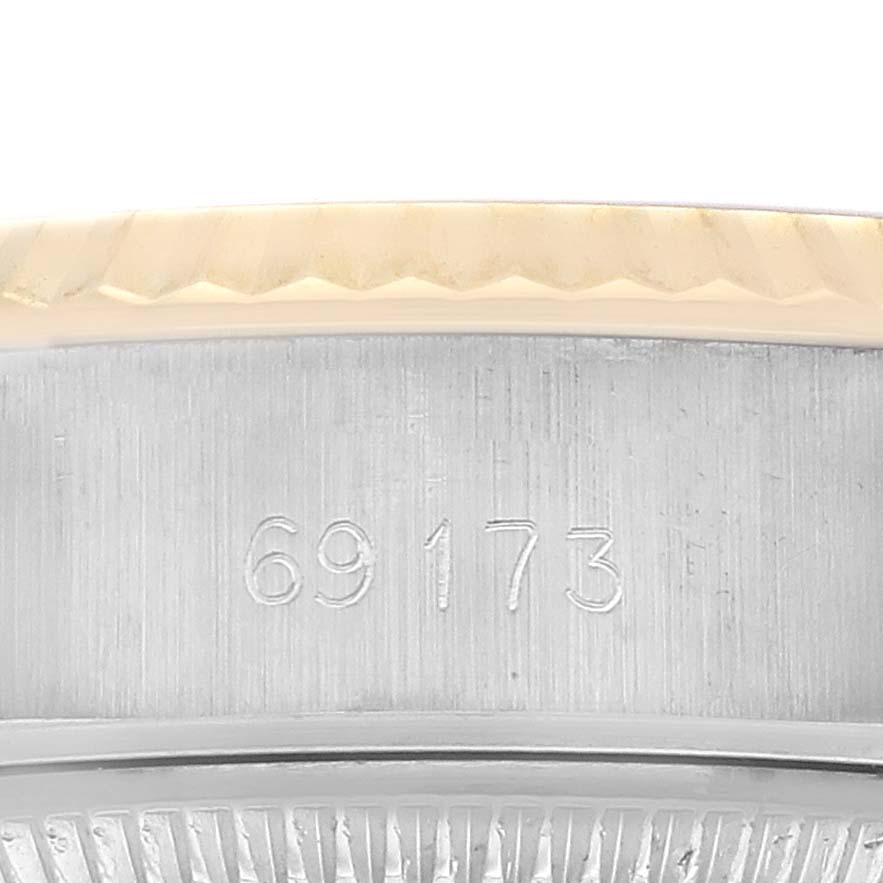 The image shows a detailed side view of the case body and bezel of a Rolex Datejust 69173 Women's Steel and Gold (two tone) Champagne Dial watch, highlighting the model number.