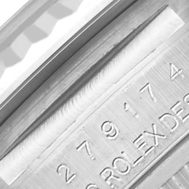 The image shows a close-up of the engraved side of the Rolex Datejust 279174 Women's Stainless Steel White Dial 279174 Women's Stainless Steel White Dial model, highlighting the serial number and branding.