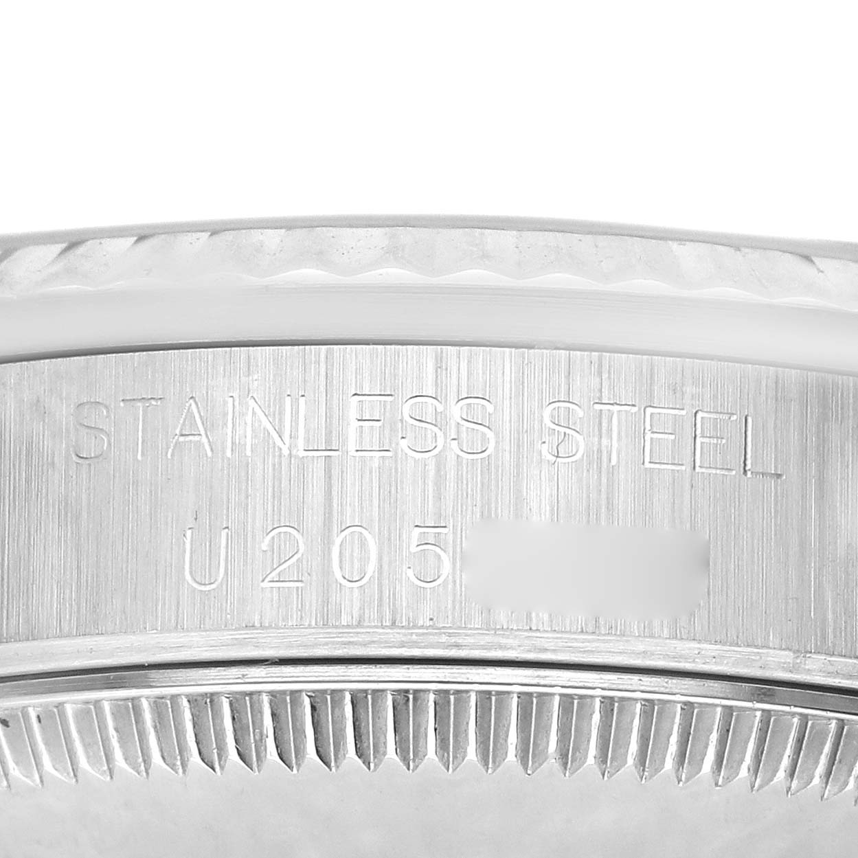 The image shows a close-up of the caseback edge for a Rolex Mid-Size 68274 Women's Stainless Steel Silver Dial 68274 Women's Stainless Steel Silver Dial watch in stainless steel.
