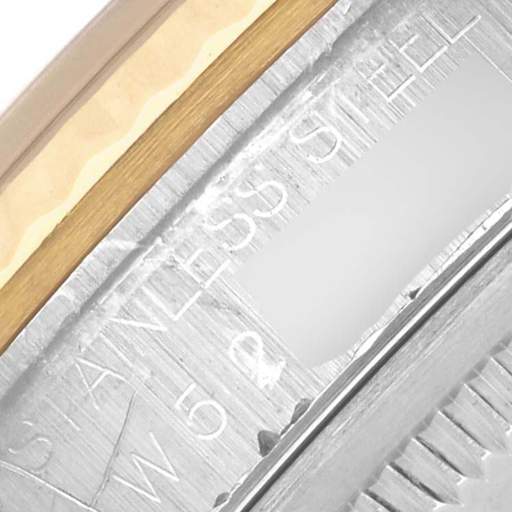 The image shows a close-up of the bezel and case details of a Rolex Datejust 16233 Men's Steel and Gold (two tone) Grey Dial 16233 Men's Steel and Gold (two tone) Grey Dial watch, featuring stainless steel.