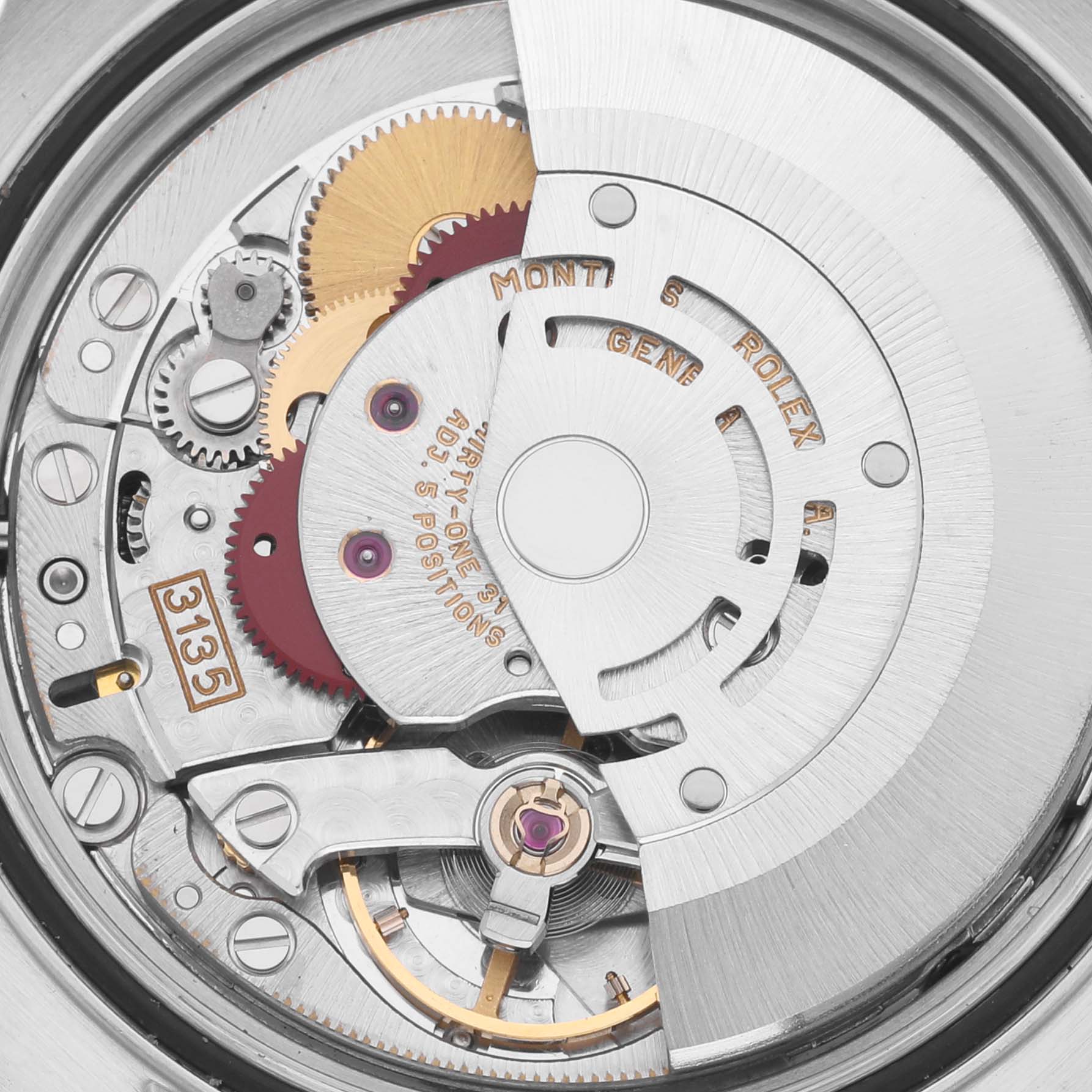 The image shows the movement of the Rolex Datejust 16233 Men's Steel and Gold (two tone) Grey Dial 16233 Men's Steel and Gold (two tone) Grey Dial watch, focusing on its intricate internal gears and rotor.