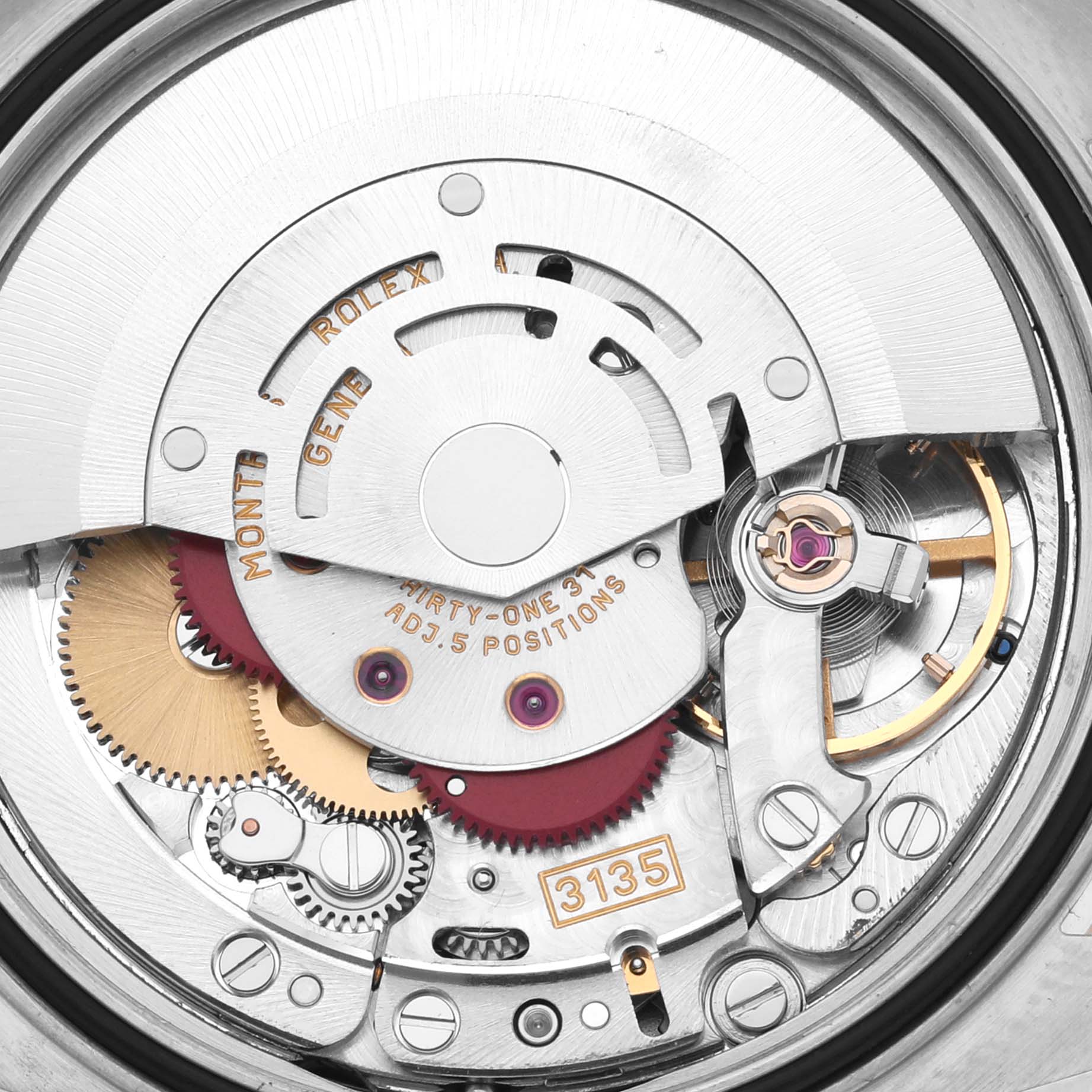 The image shows the movement and inner workings of a Rolex Datejust 16233 Men's Steel and Gold (two tone) Mother of Pearl Dial 16233 Men's Steel and Gold (two tone) Mother of Pearl Dial, focusing on its gears and components.