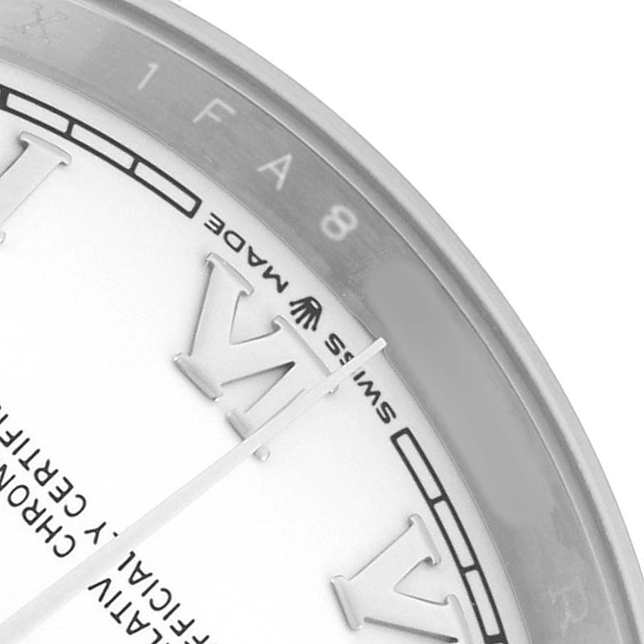 The image shows a close-up of the Rolex Datejust 126200 Men's Stainless Steel White Dial watch face, focusing on the “Swiss Made” text and part of the bezel and dial.