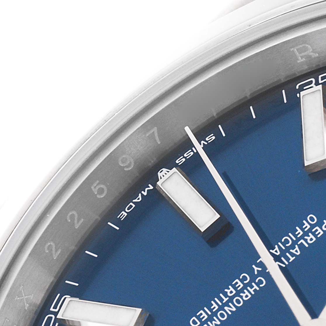 The image shows a close-up of the dial and bezel of a Rolex Datejust 41 126300 Men's Stainless Steel Blue Dial 126300 Men's Stainless Steel Blue Dial watch, focusing on the indices and text details.