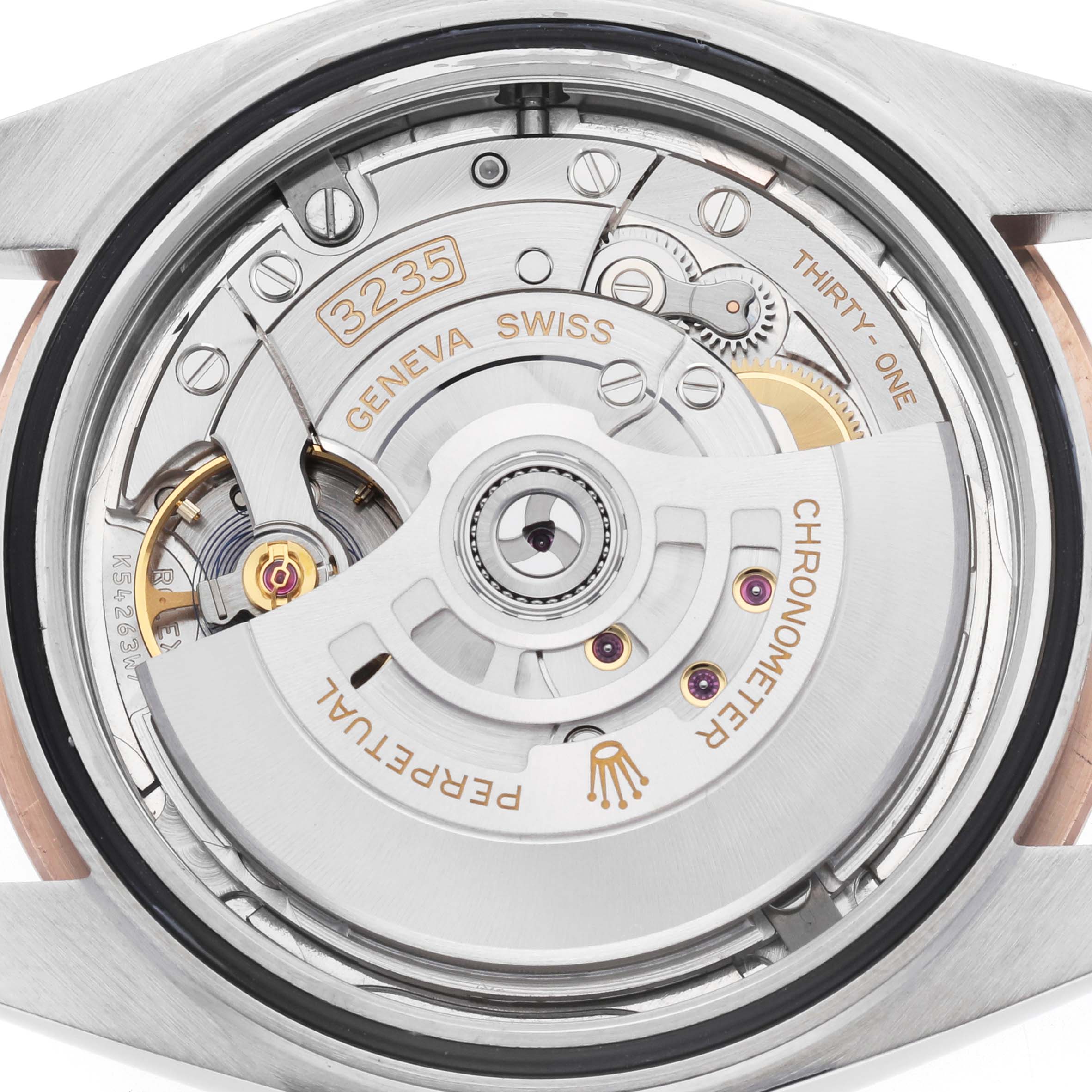 The image shows the movement of a Rolex Datejust 41 126331 Men's Steel and Gold (two tone) Pink Dial, highlighting the caliber 3235 through a transparent case back.