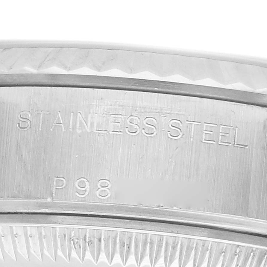The image shows an engraved side view of the bezel and case back of a Rolex Datejust 79174 Women's Stainless Steel Silver Dial, highlighting the "STAINLESS STEEL" inscription.