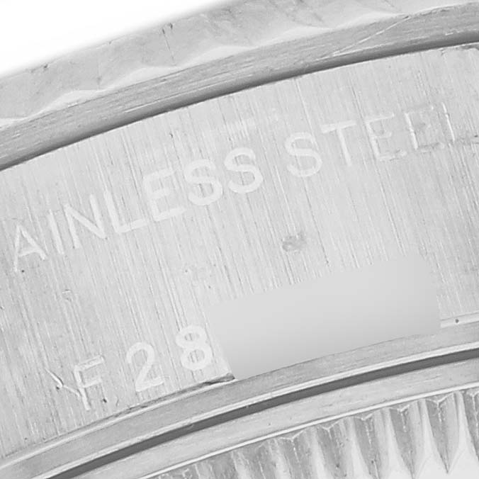 The image shows a close-up of the back case engraving of a Rolex Datejust 79174 Women's Stainless Steel Black Dial 79174 Women's Stainless Steel Black Dial watch, highlighting the stainless steel marking.