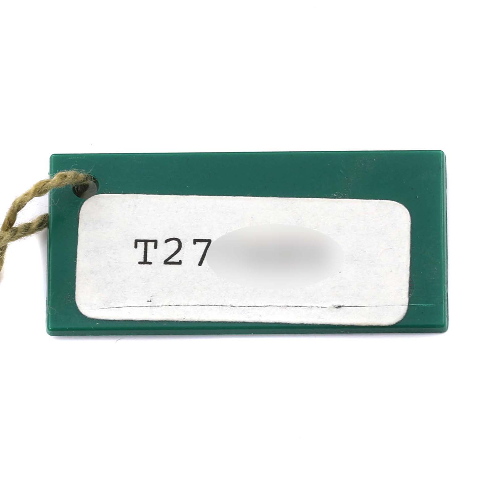 The image shows a green tag with a twine, presumably an accessory for a Rolex Datejust 69173 Women's Steel and Gold (two tone) Blue Dial 69173 Women's Steel and Gold (two tone) Blue Dial model watch.