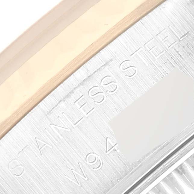 This image shows a close-up of the Rolex Datejust 69173 Women's Steel and Gold (two tone) Champagne Dial 69173 Women's Steel and Gold (two tone) Champagne Dial's stainless steel case with engraved details.