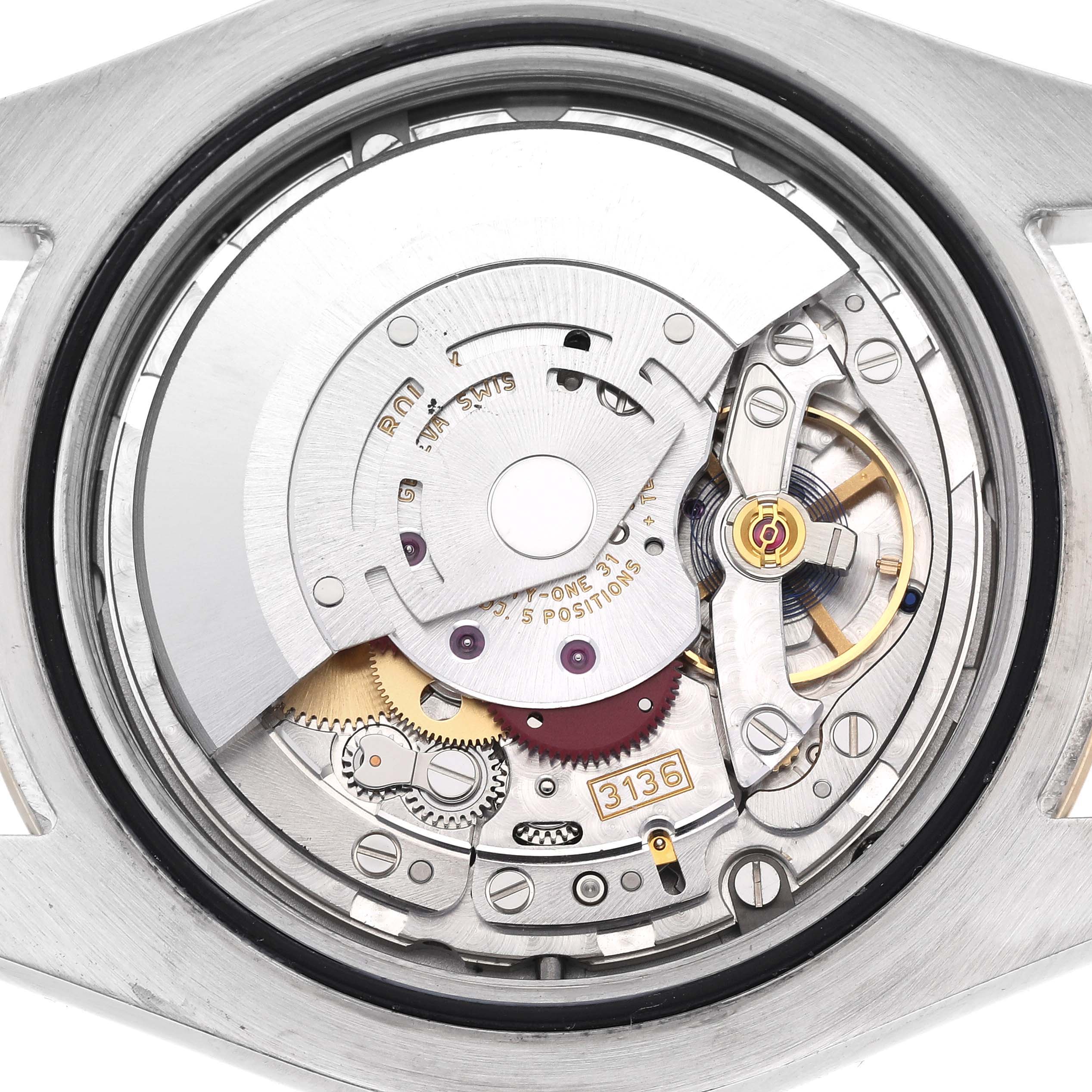 The image shows the movement mechanism of the Rolex Datejust 41 116333 Men's Steel and Gold (two tone) Grey Dial 116333 Men's Steel and Gold (two tone) Grey Dial from a back view, highlighting gears and components.