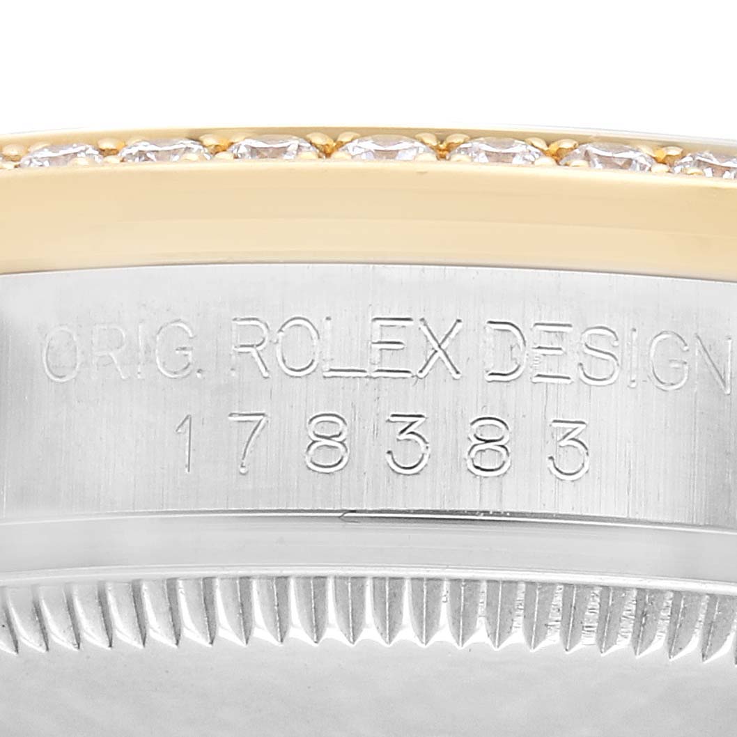The image shows the side of a Rolex Mid-Size M178383-0008 Women's Steel and Gold (two tone) Champagne Dial watch case, highlighting the engraved model number and part of the bezel.