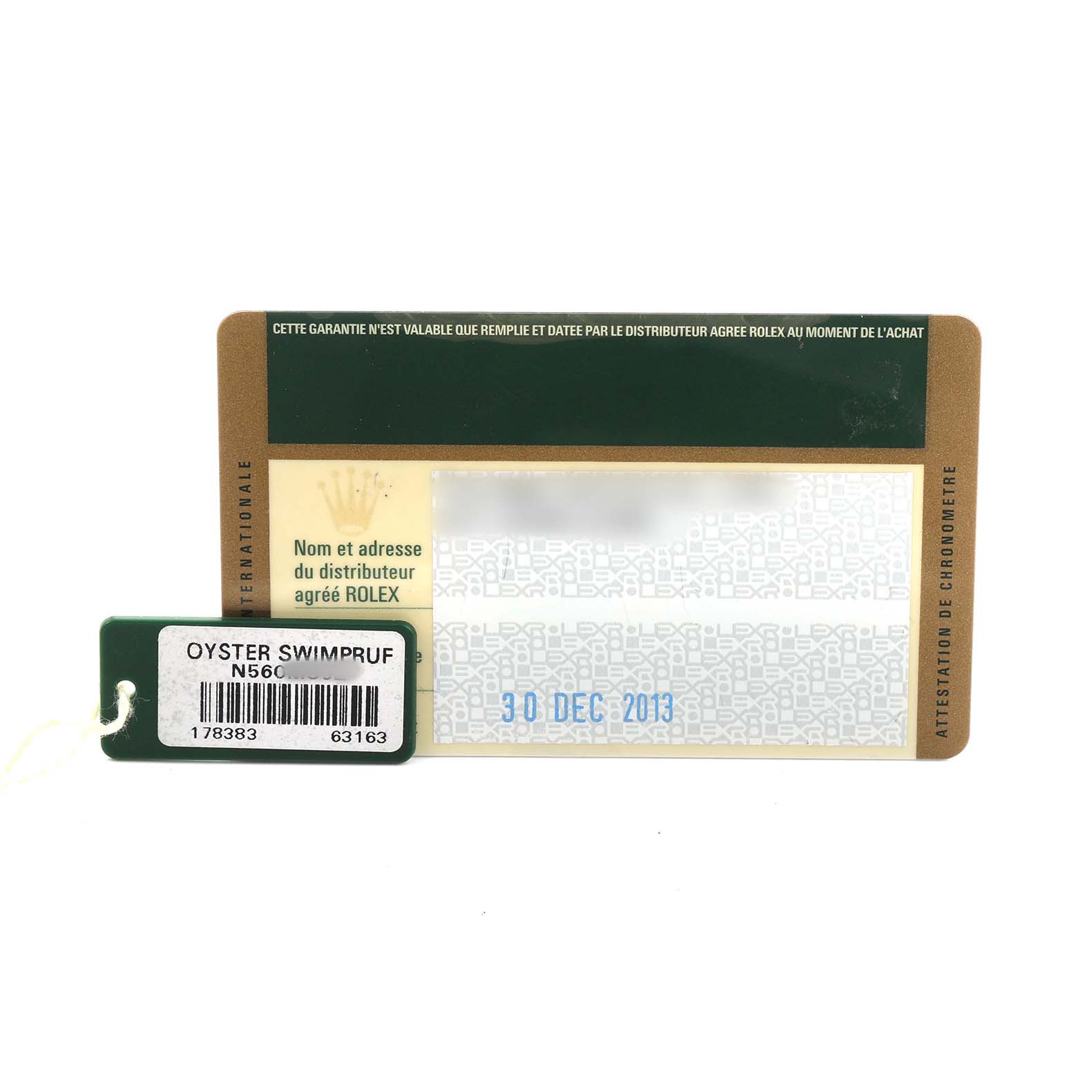 The image shows a warranty card and tag for a Rolex Mid-Size M178383-0008 Women's Steel and Gold (two tone) Champagne Dial model, viewed from above.