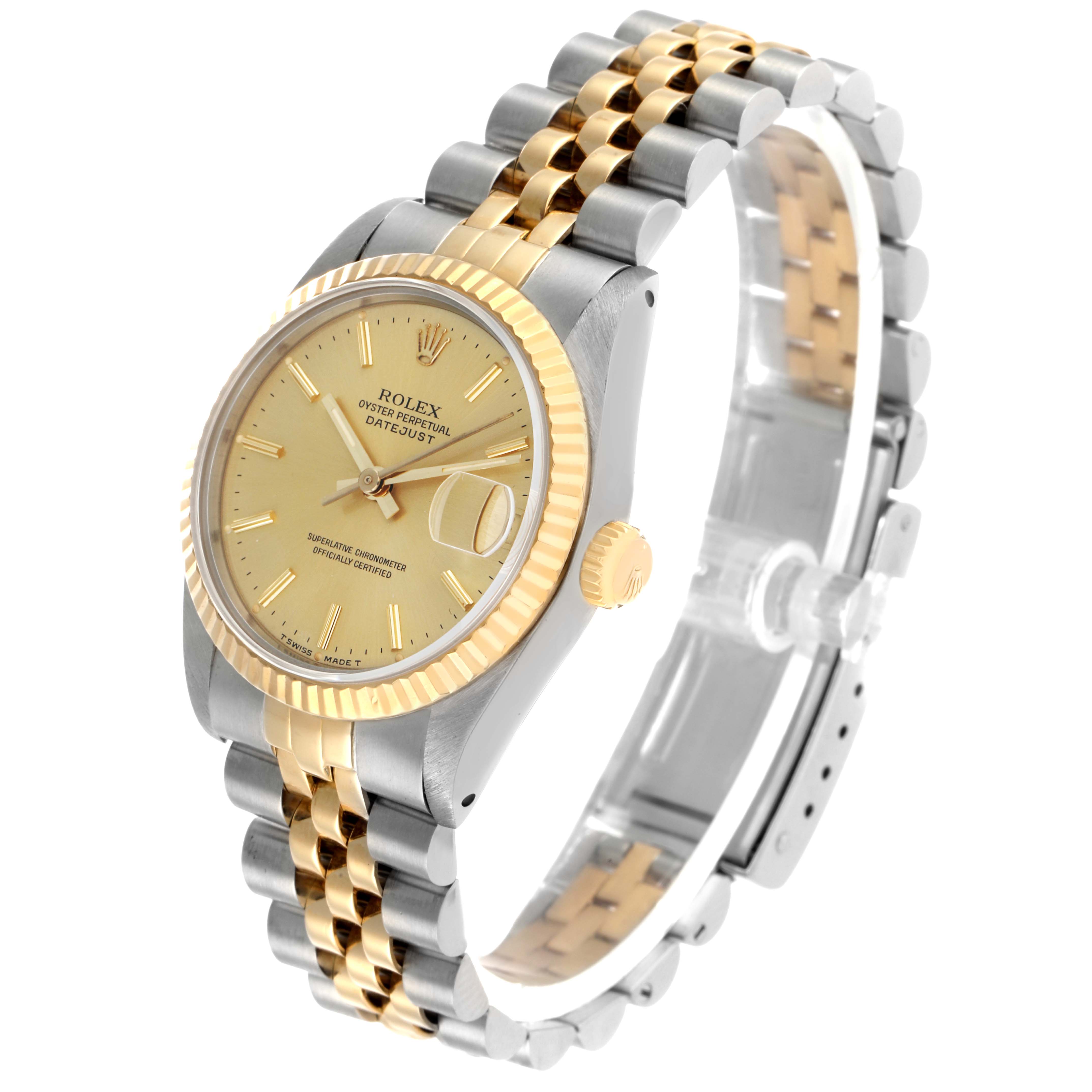 The Rolex Datejust 68273 Women's Steel and Gold (two tone) Champagne Dial watch is shown at a three-quarter angle, revealing the bezel, dial, crown, and Jubilee bracelet.