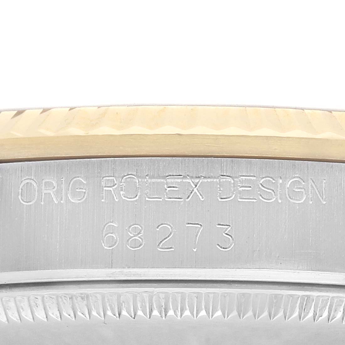 The image shows a close-up of the side of a Rolex Datejust 68273 Women's Steel and Gold (two tone) Champagne Dial watch, highlighting the engraved "ORIG ROLEX DESIGN" and model number.