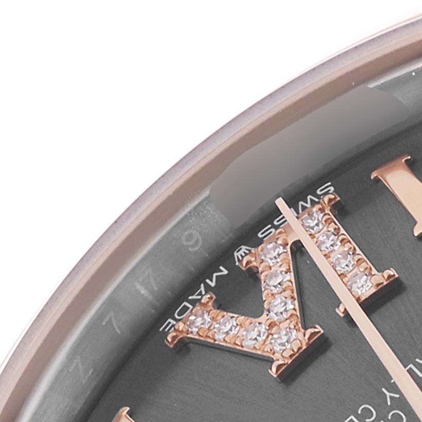 The image shows a close-up of the dial and gemstone-studded Roman numeral of a Mid-Size Rolex watch.