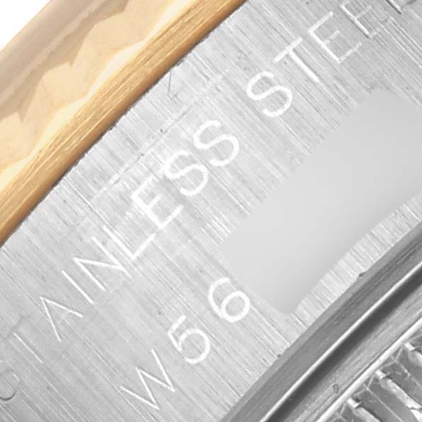 The image shows a close-up of the Rolex Datejust 69173 Women's Steel and Gold (two tone) Beige Dial 69173 Women's Steel and Gold (two tone) Beige Dial watch case with stainless steel markings.