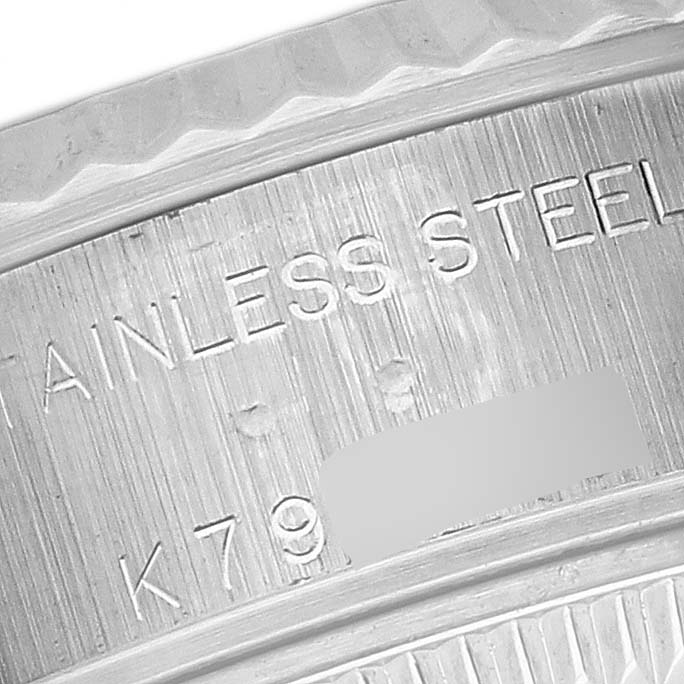 The image shows a close-up of the stainless steel case markings on a Rolex Datejust 79174 Women's Stainless Steel Pink Dial 79174 Women's Stainless Steel Pink Dial watch.