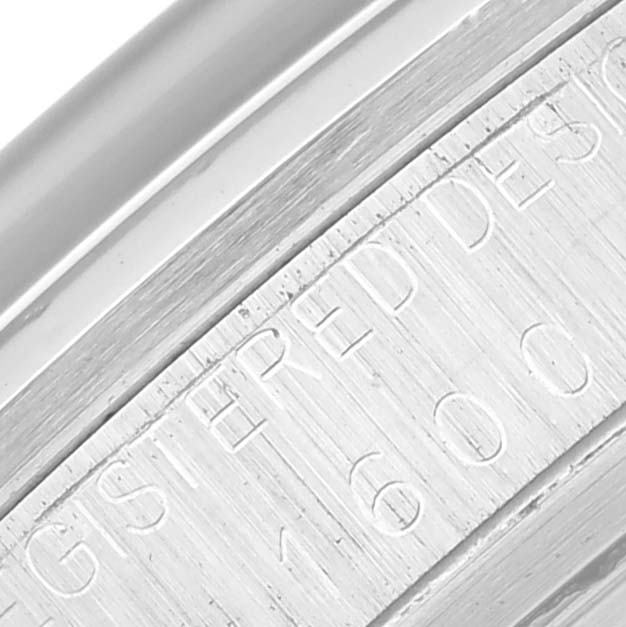 The image shows a close-up view of the engraved caseback edge of the Rolex Vintage Collection 1600 Men's Stainless Steel Silver Dial 1600 Men's Stainless Steel Silver Dial model.