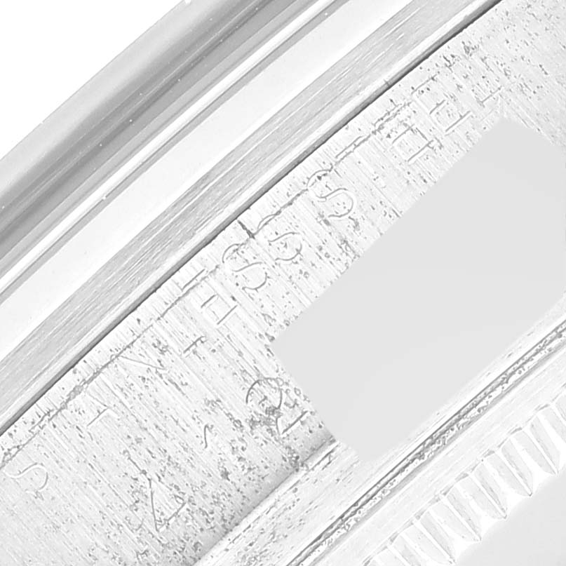This image shows a close-up of the engraved bezel and edge of the casing for a Rolex Vintage Collection 1600 Men's Stainless Steel Silver Dial 1600 Men's Stainless Steel Silver Dial watch.